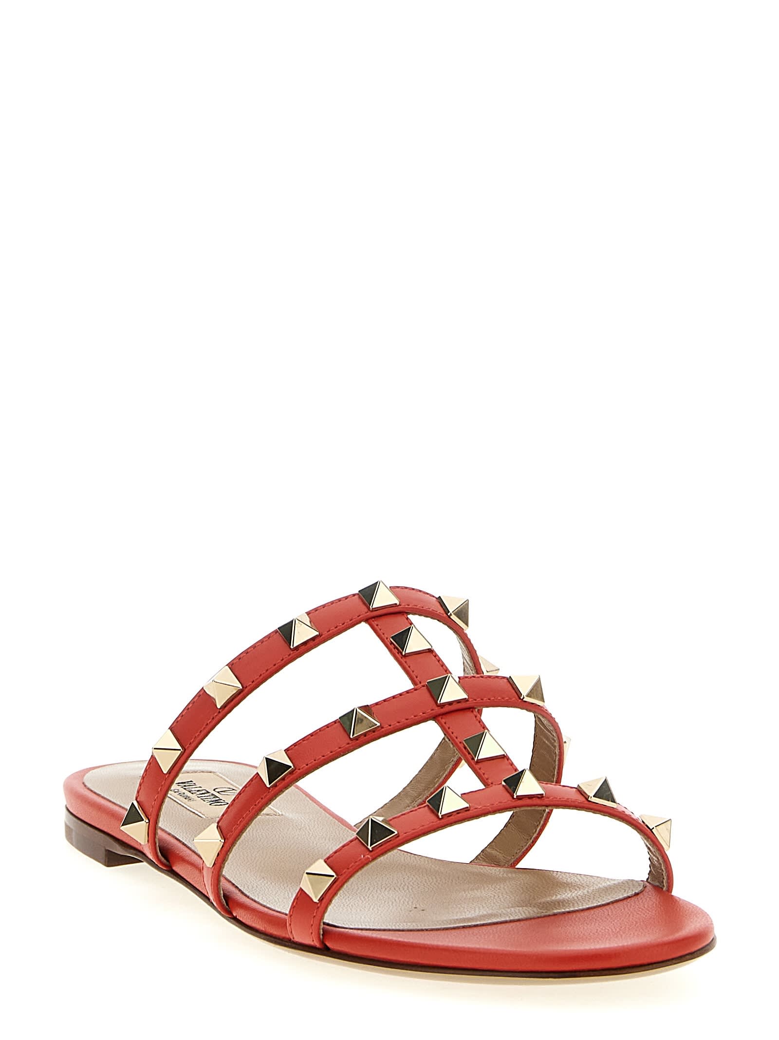 Valentino Rockstud Flat Sole Open Toe Sandals In Red