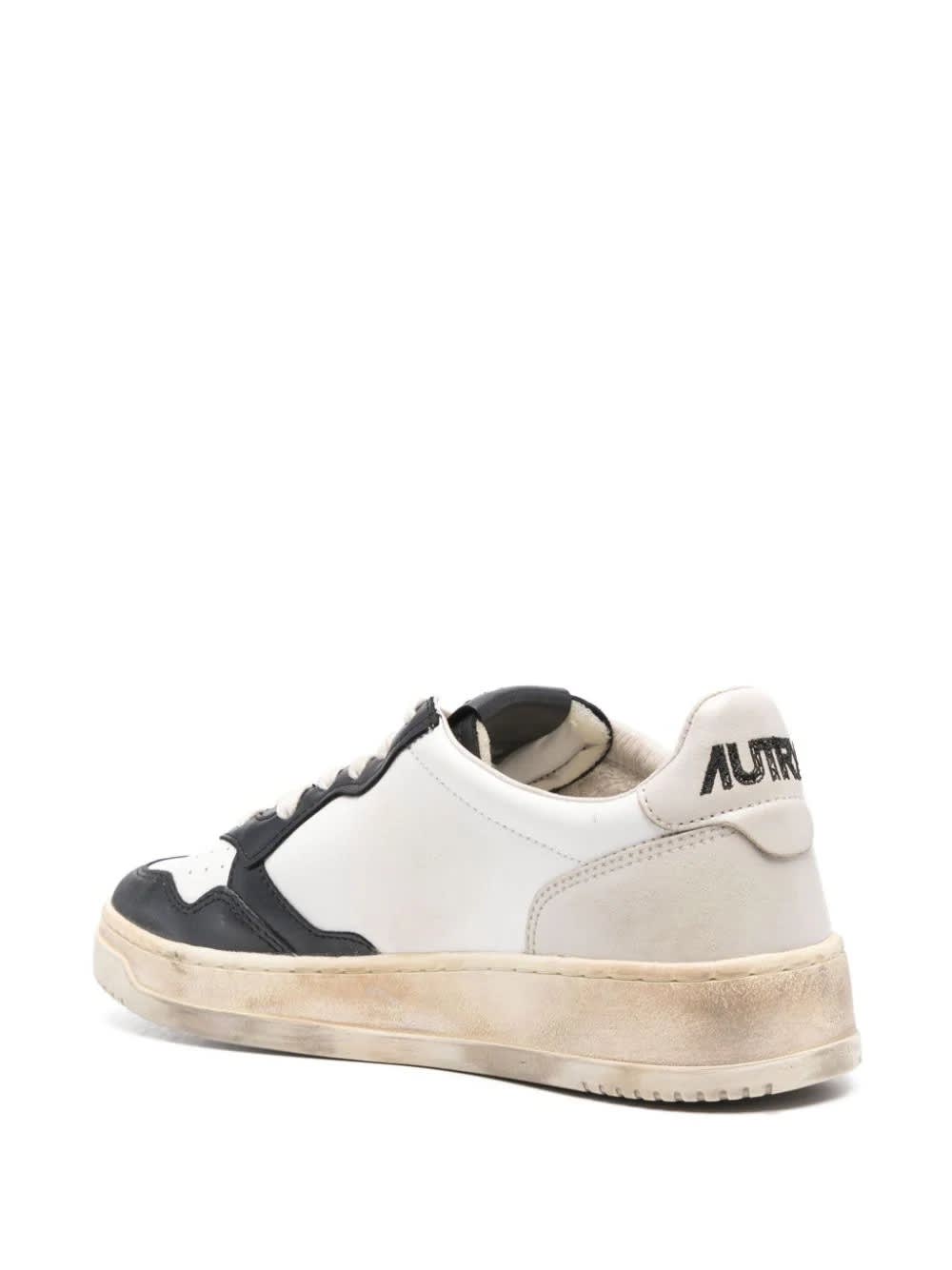 Shop Autry Super Vintage Medalist Low Sneakers In Black And White Leather