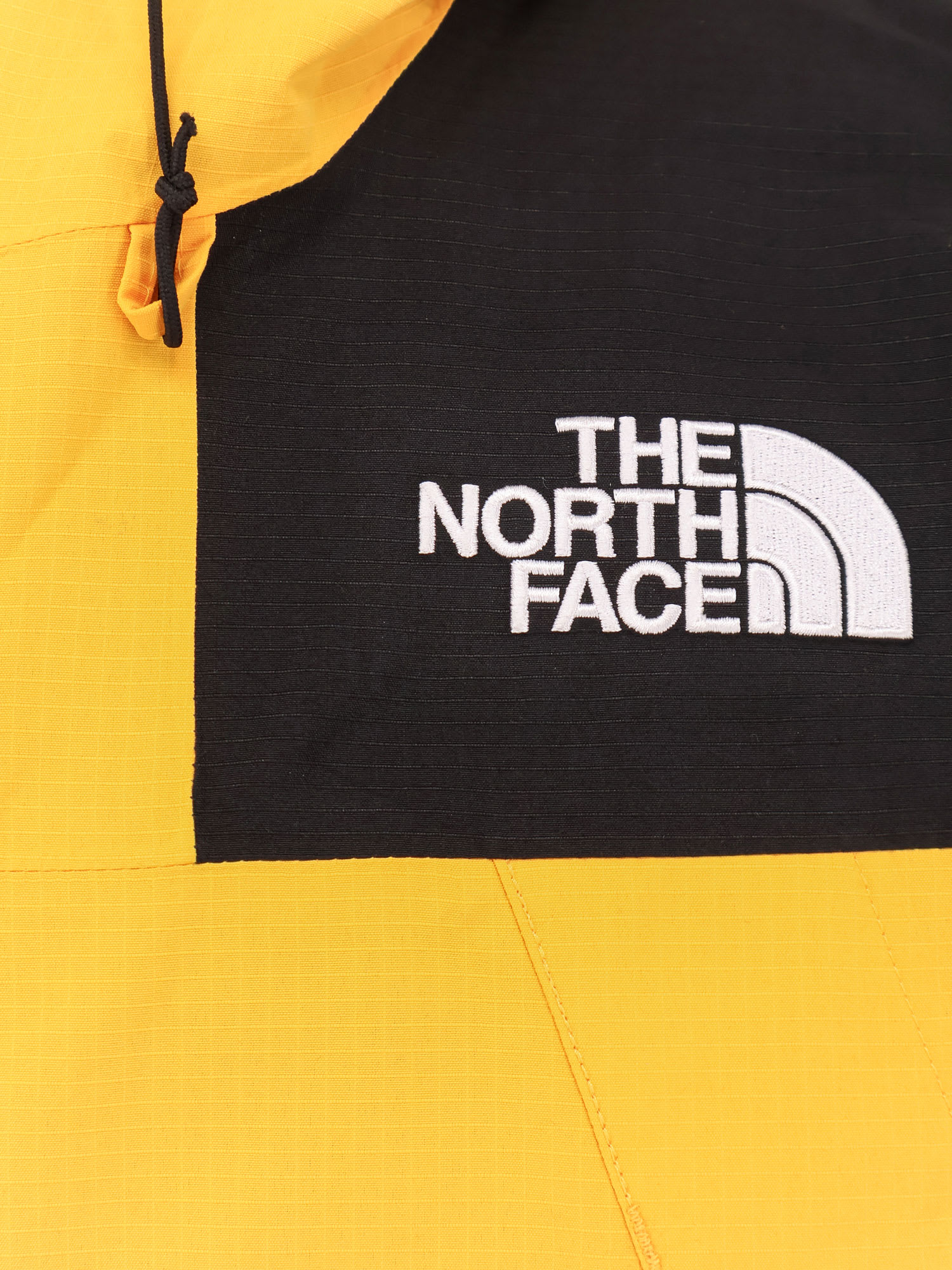 The North Face Windbreaker Jacket With Drawstring And Hood In Yellow