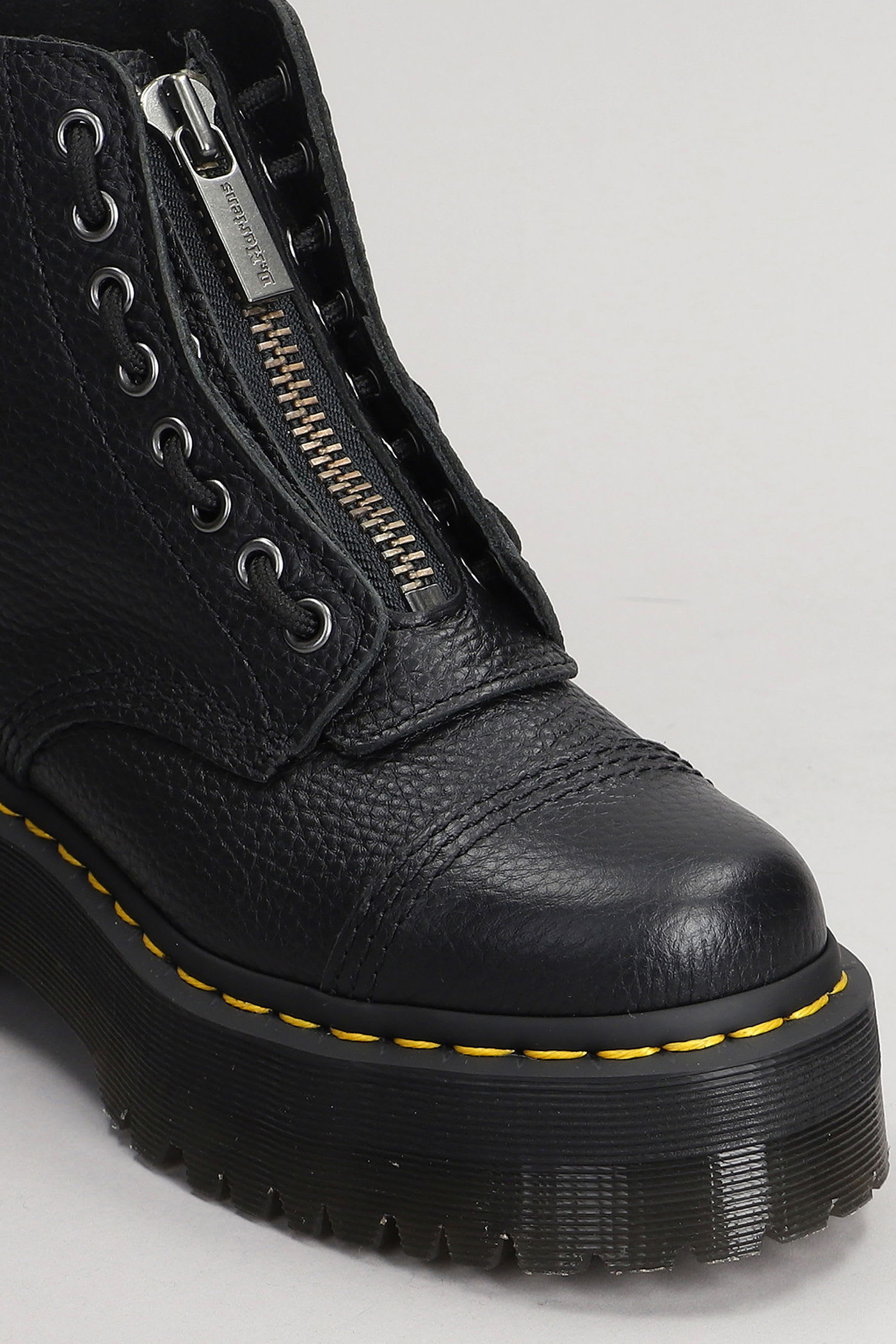 Dr. Martens Sinclair Combat Boot In Black Hammered Leather With A Large Treaded Sole In Animal Print