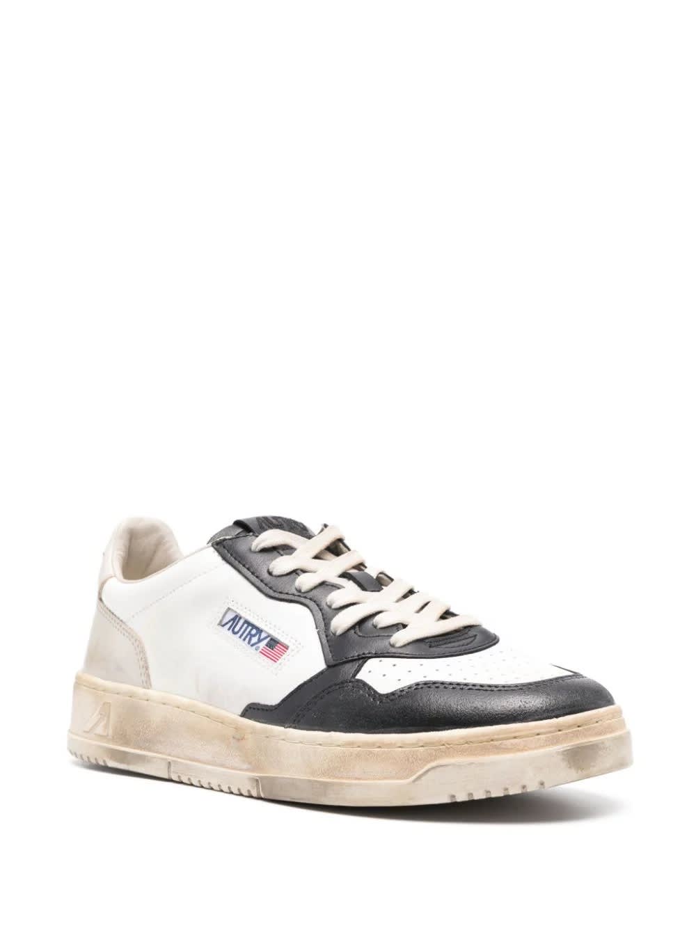 Shop Autry Super Vintage Medalist Low Sneakers In Black And White Leather