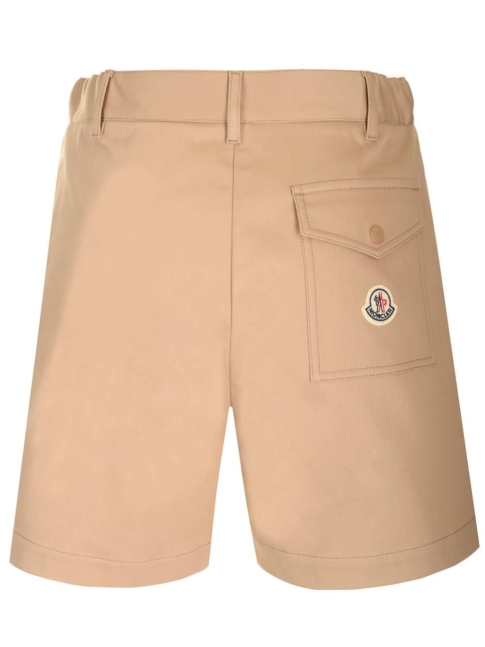 Shop Moncler Logo Patch Pleated Shorts In Beige