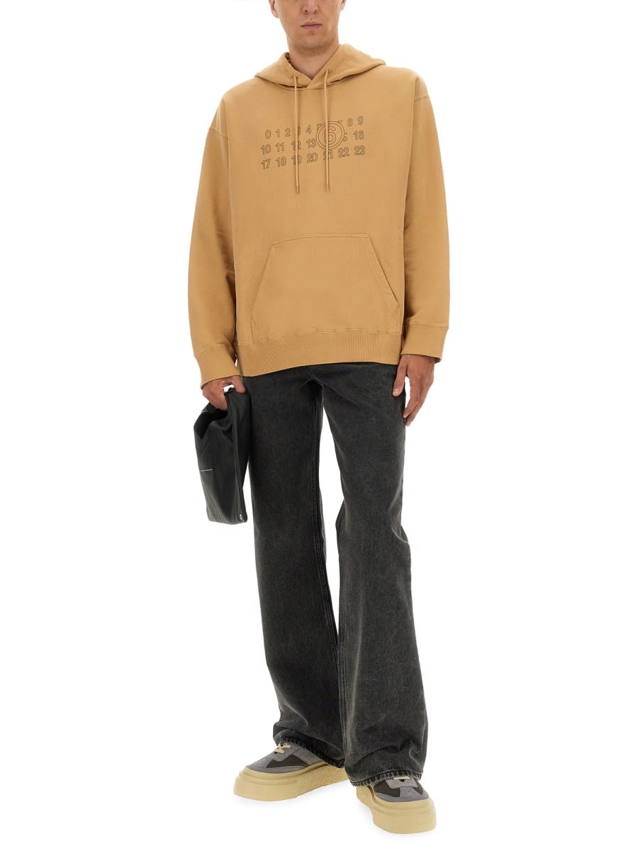 Mm6 Maison Margiela Mm6 By Maison Margiela Relaxed-fit Cotton Hoodie With Unique Graphic Print In Brown