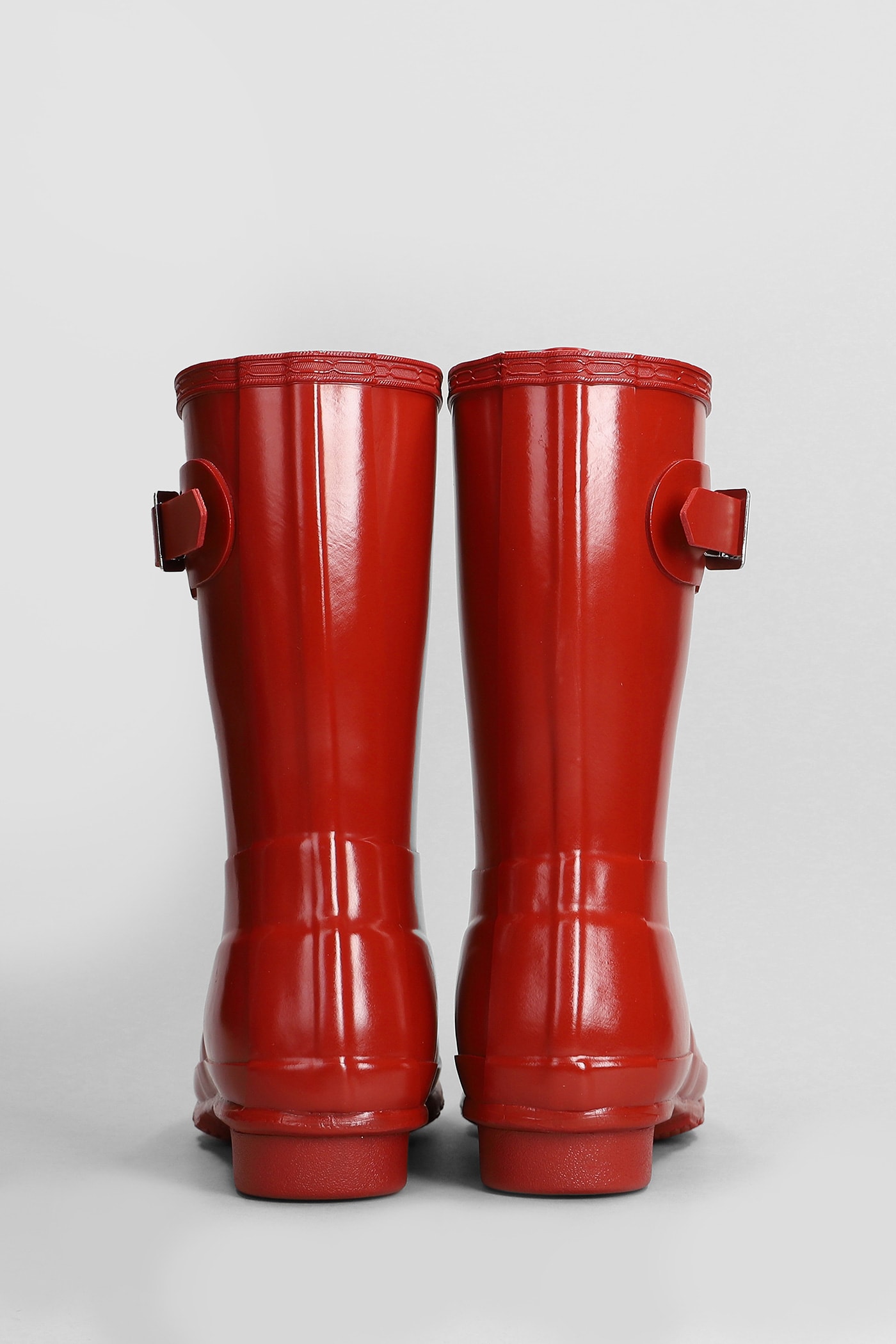 Shop Hunter Original Short Gloss Low Heels Boots In Red Rubber/plasic