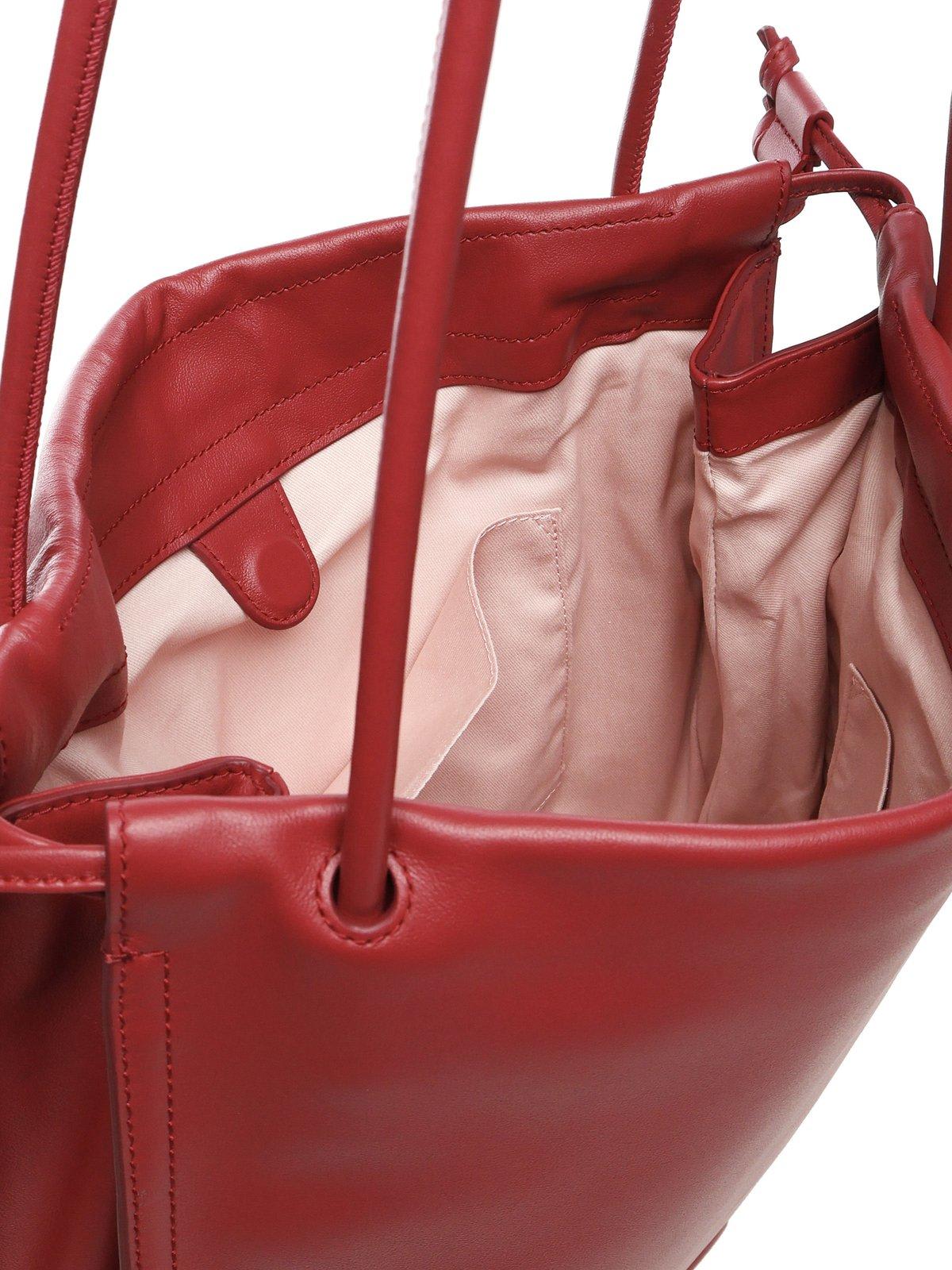 Coccinelle Logo Embossed Drawstring Tote Bag In Red