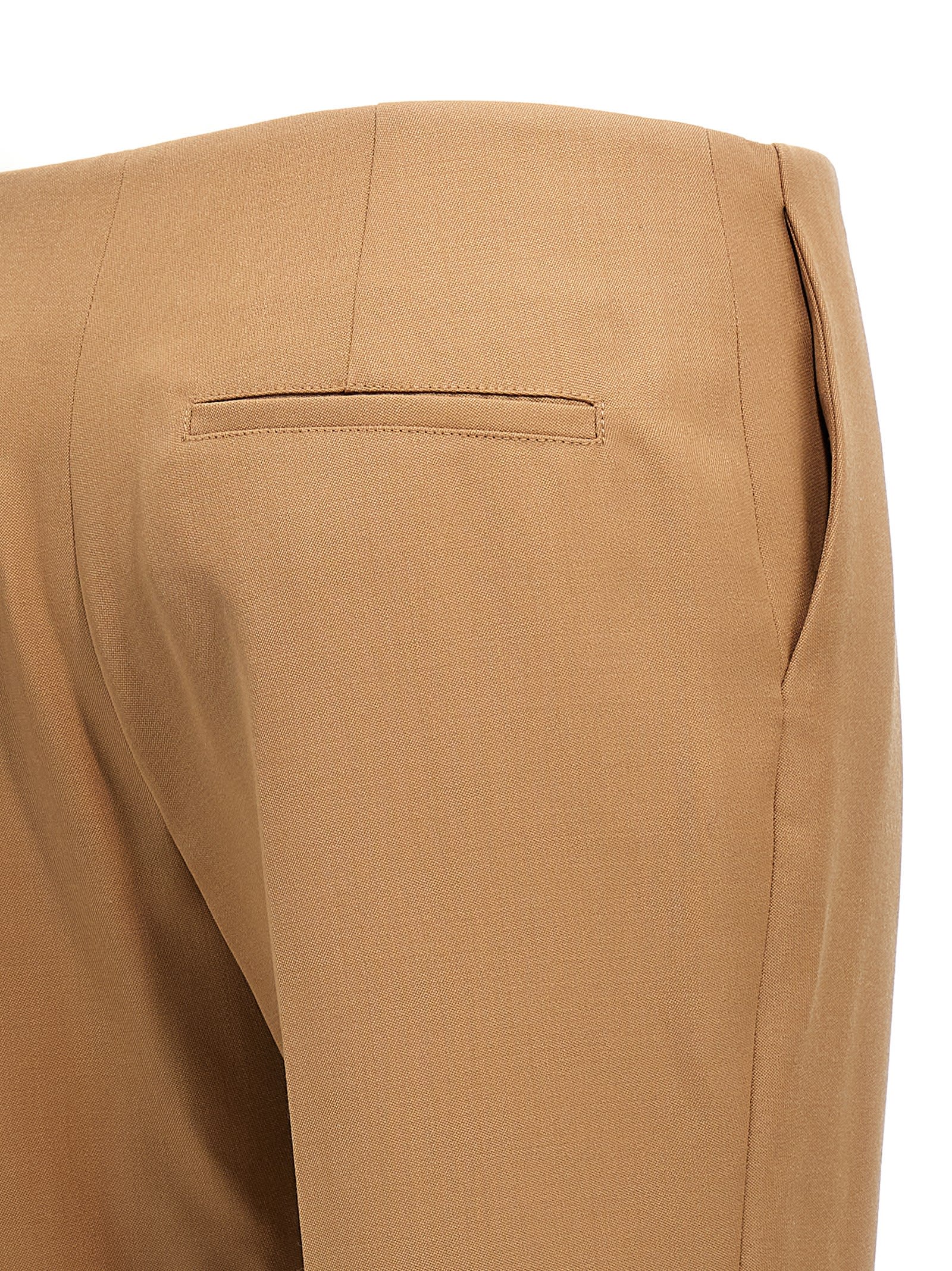 Shop Chloé Asymmetrical Hem Pants In Brown