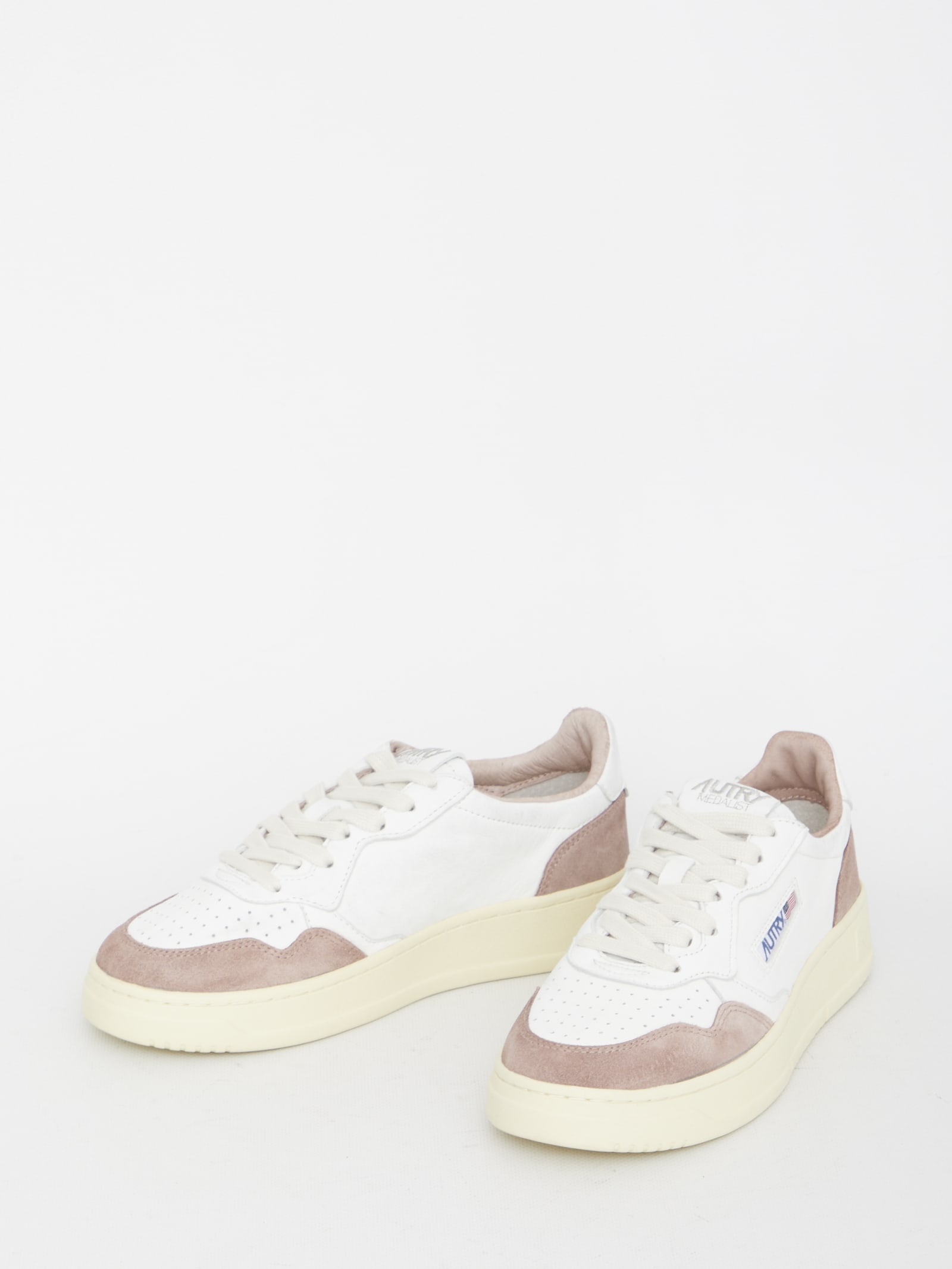 Shop Autry Medalist Sneakers In White, Pink