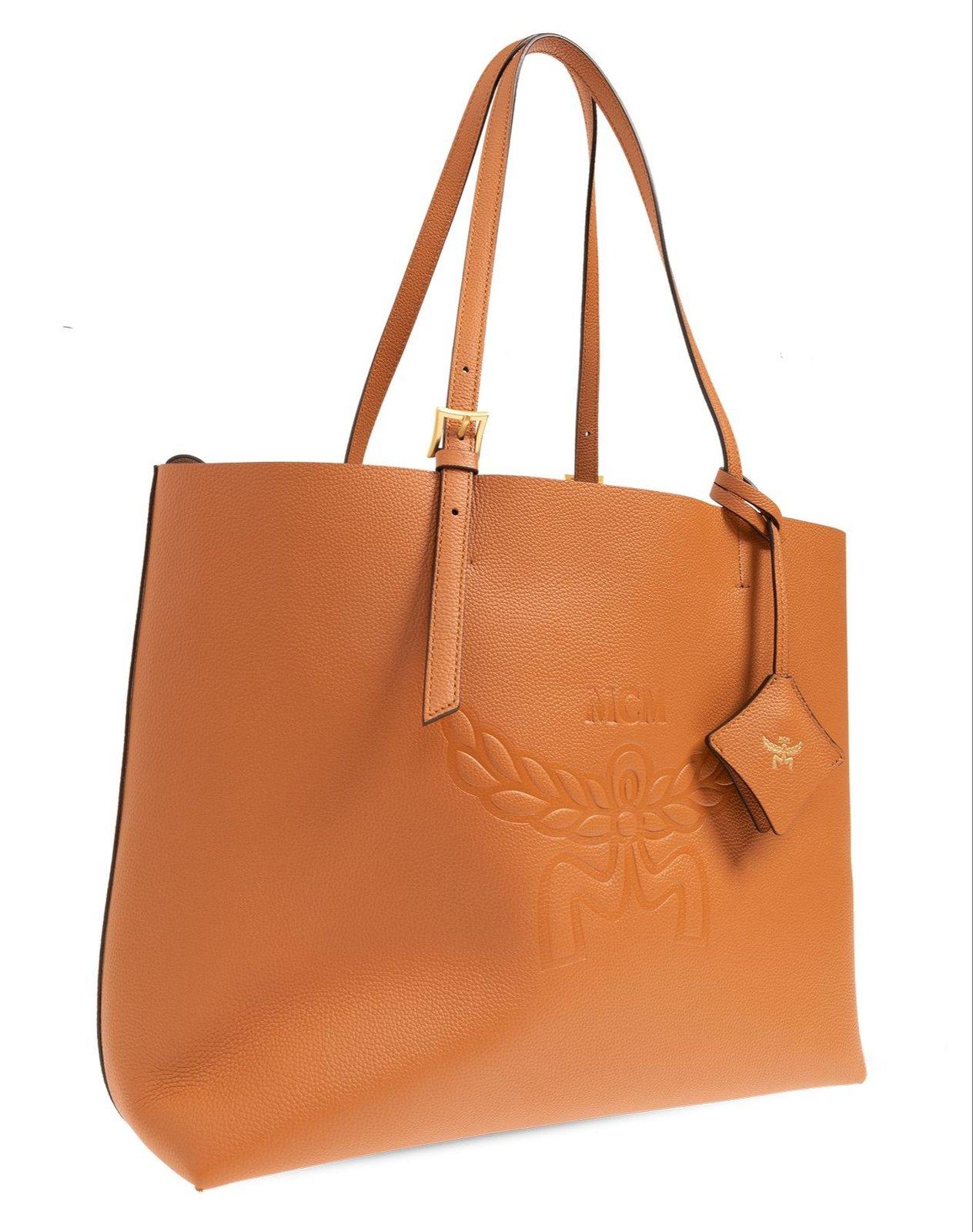 Shop Mcm Himmel Logo Debossed Shoulder Bag In Brown