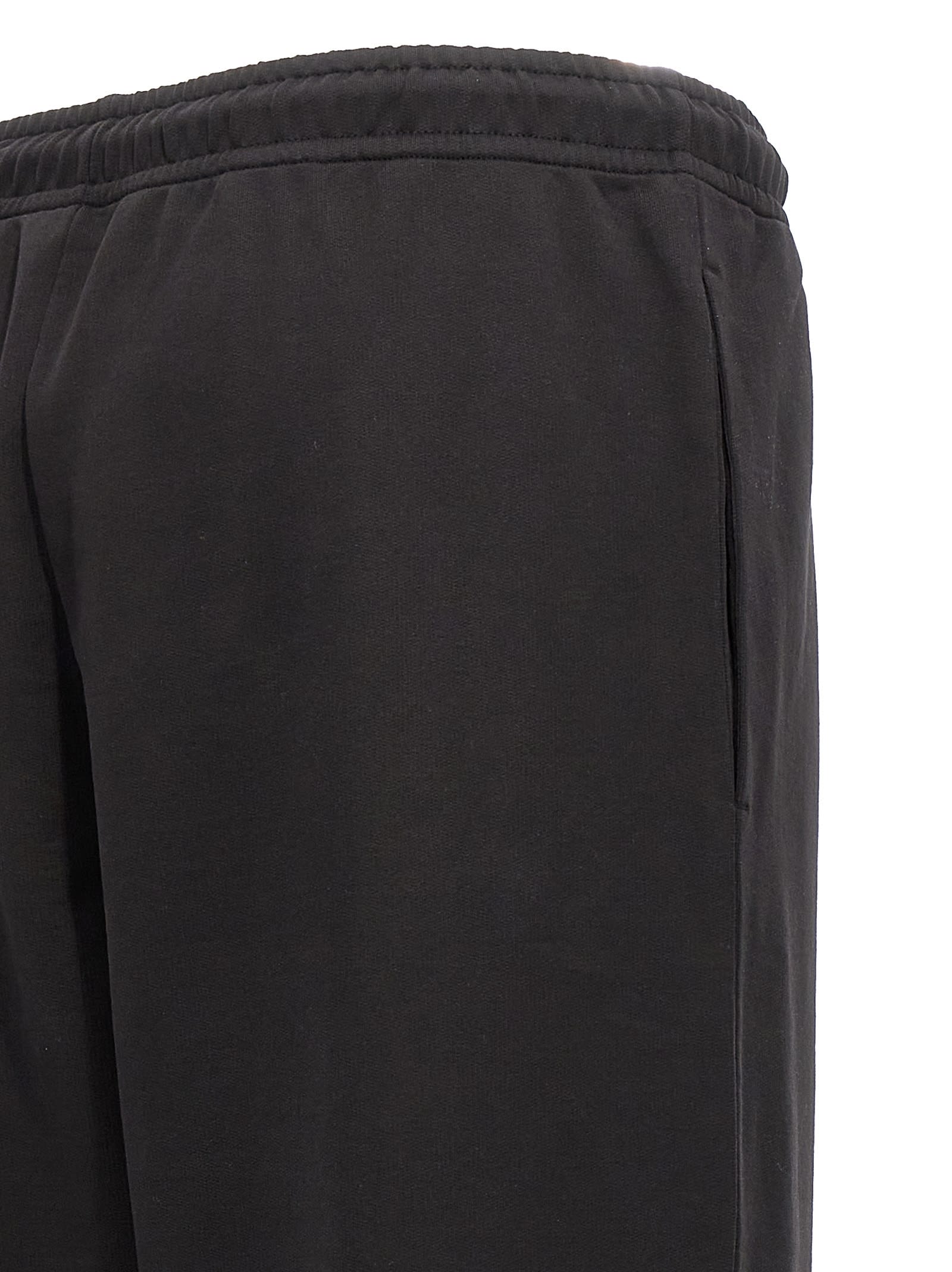 Shop Moncler Logo Patch Sweatpants In Black