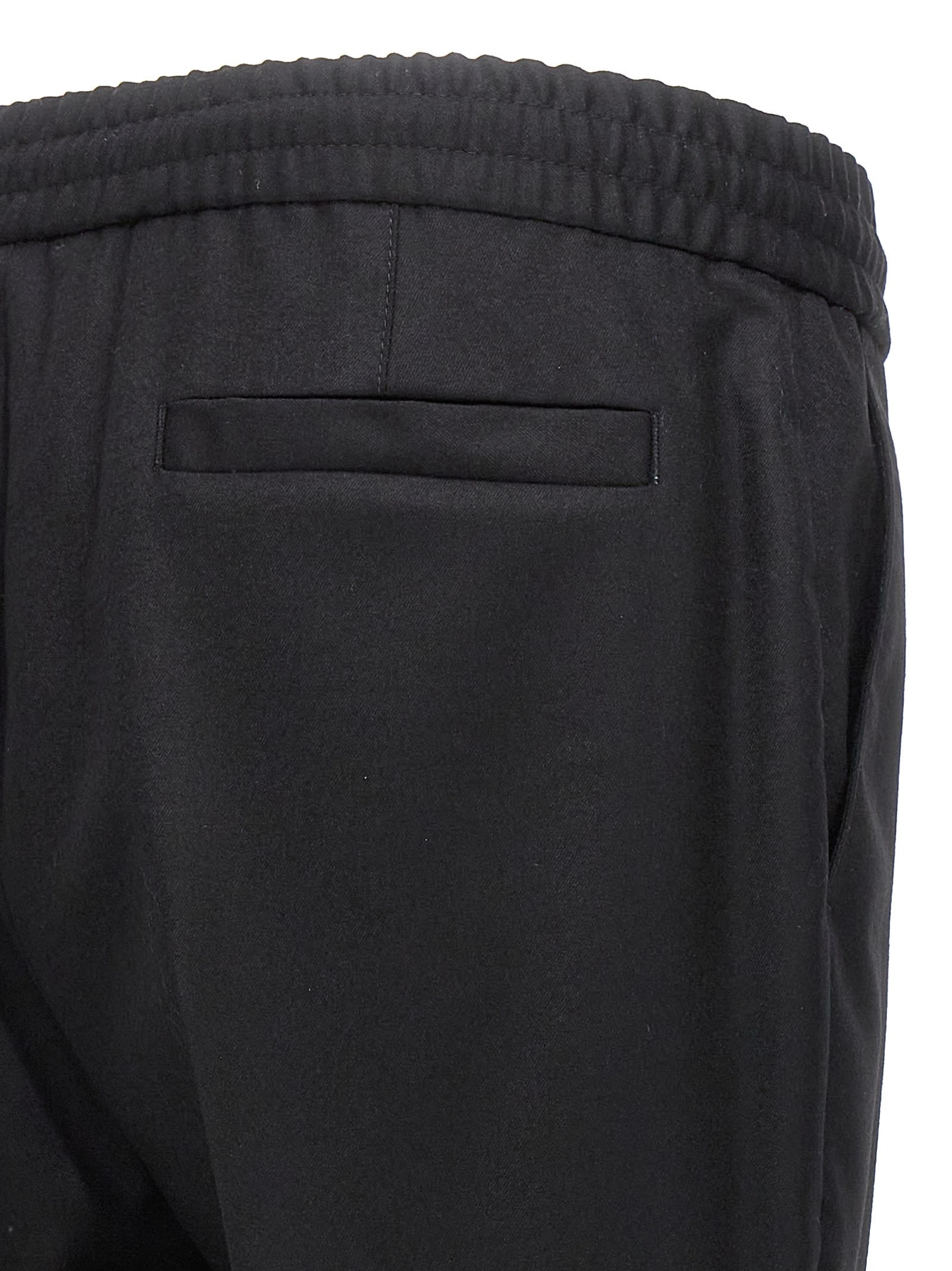Shop Brunello Cucinelli Wool Pants With Front Pleats In Black