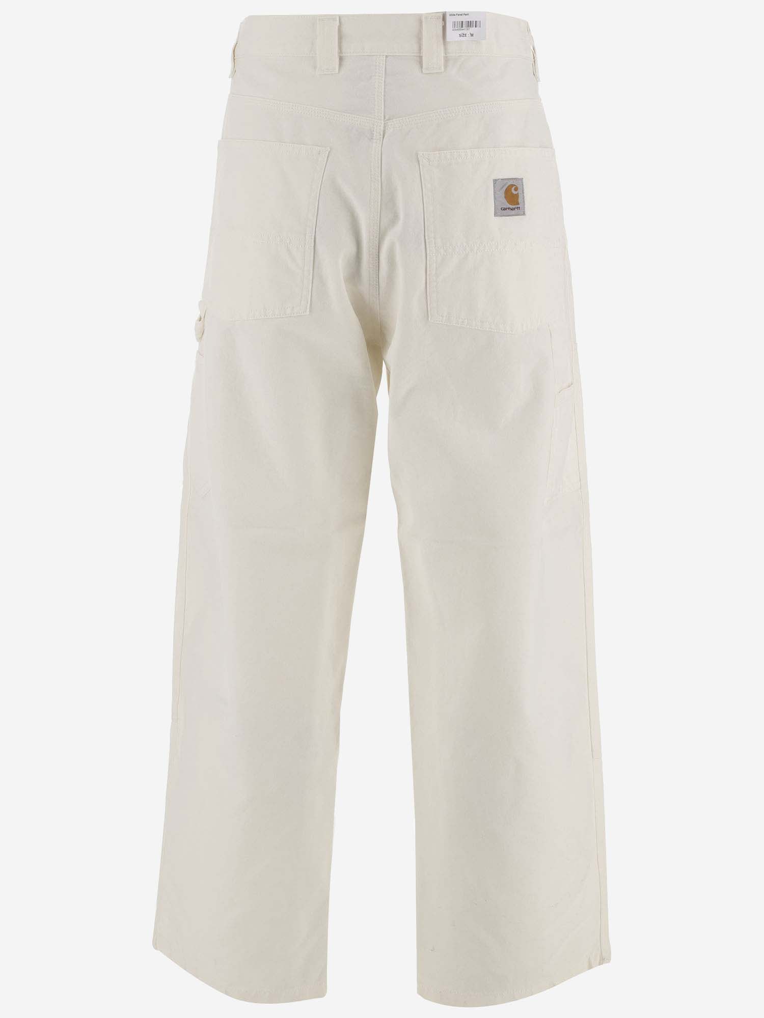 Shop Carhartt Wide-leg Trousers With Logo Patch In Wax