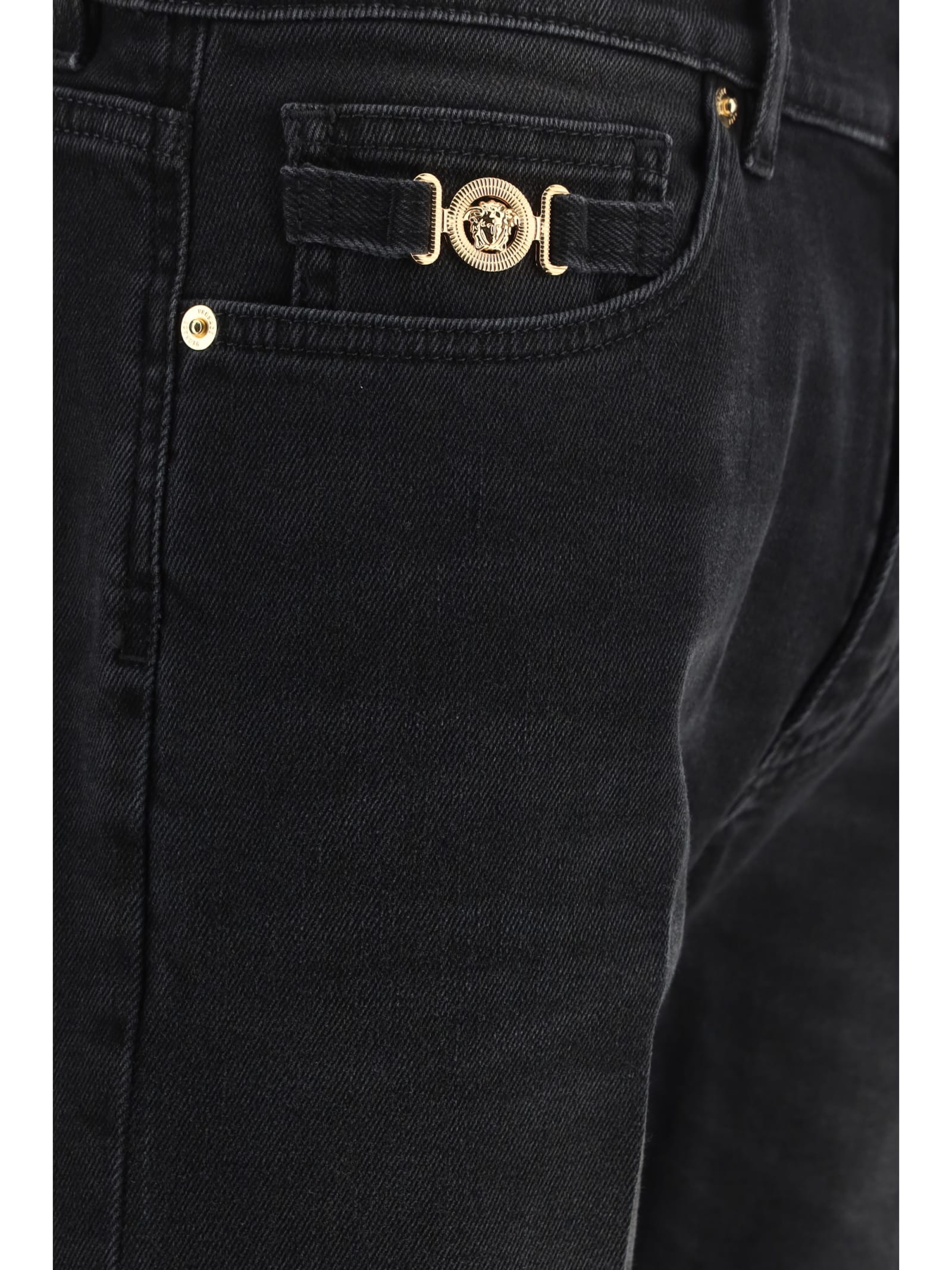 Shop Versace Pants In Faded Washed Black (black)