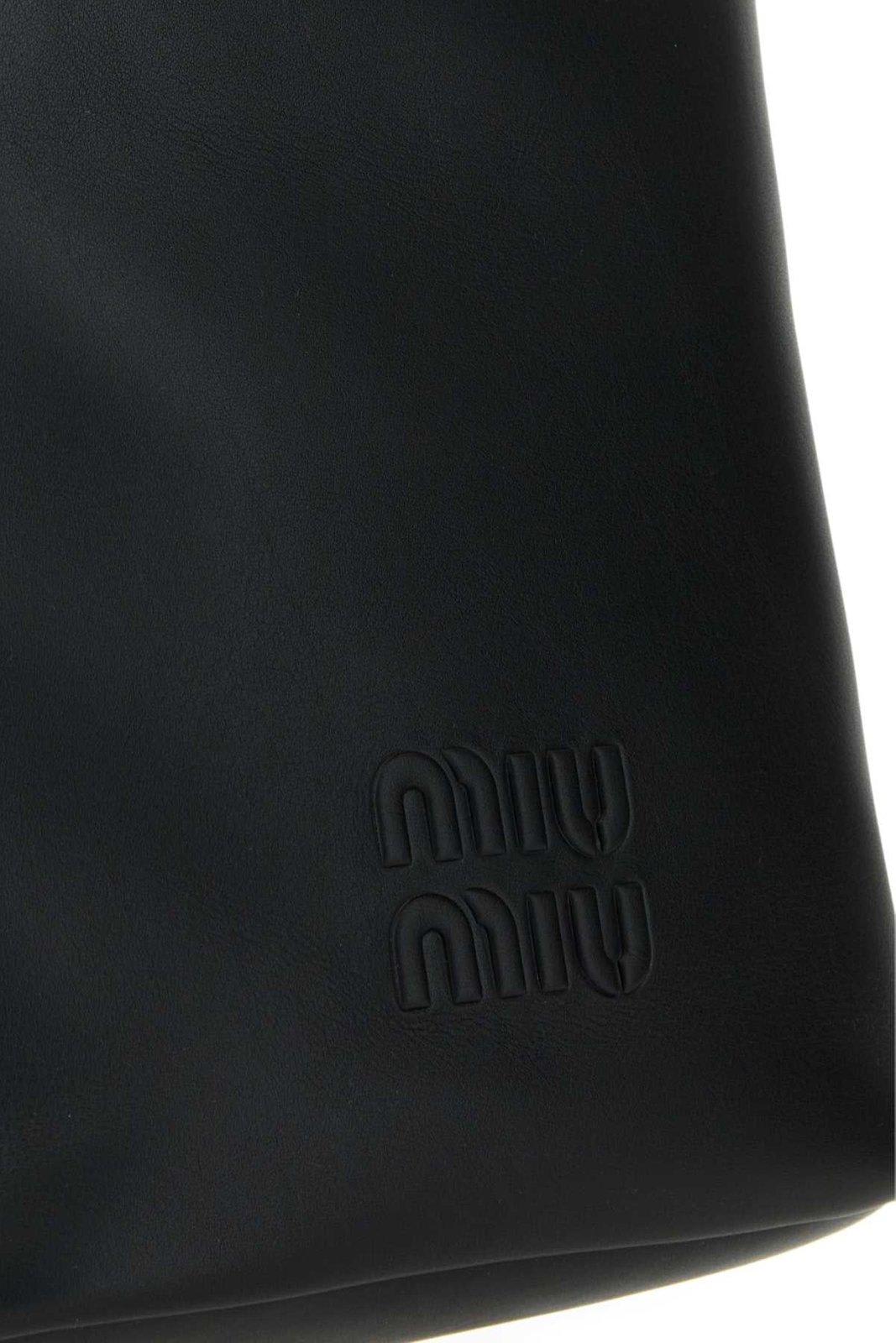 Shop Miu Miu Logo-embossed Drawstring Bucket Bag In Nero