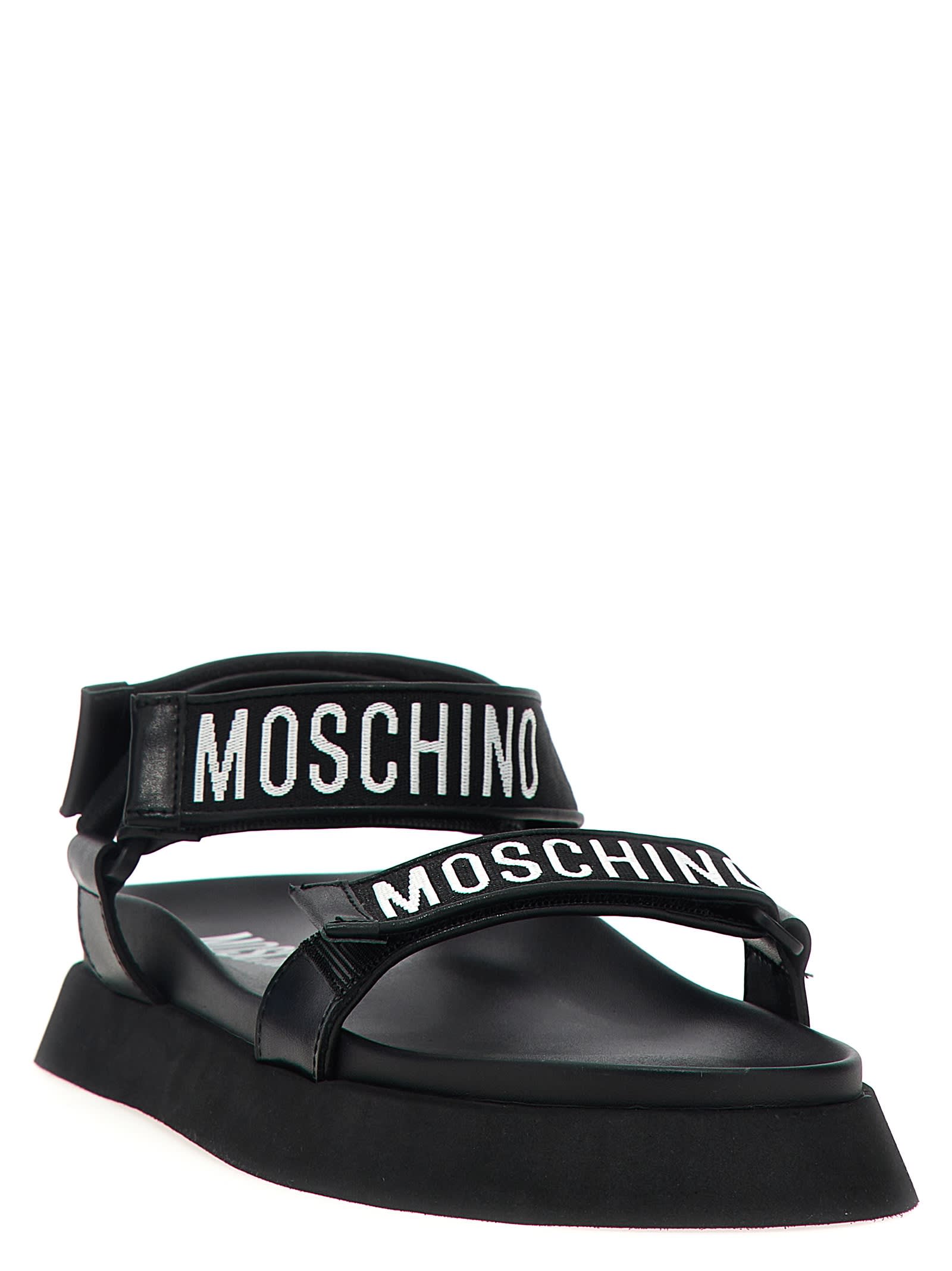 Shop Moschino Fussbet Sandals In White/black