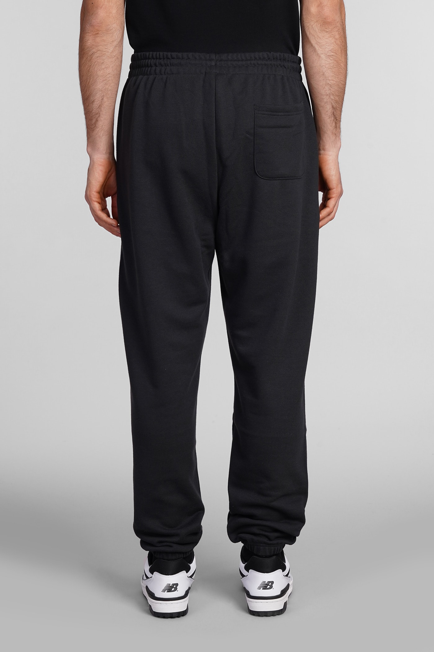 Shop New Balance Pants In Black Cotton