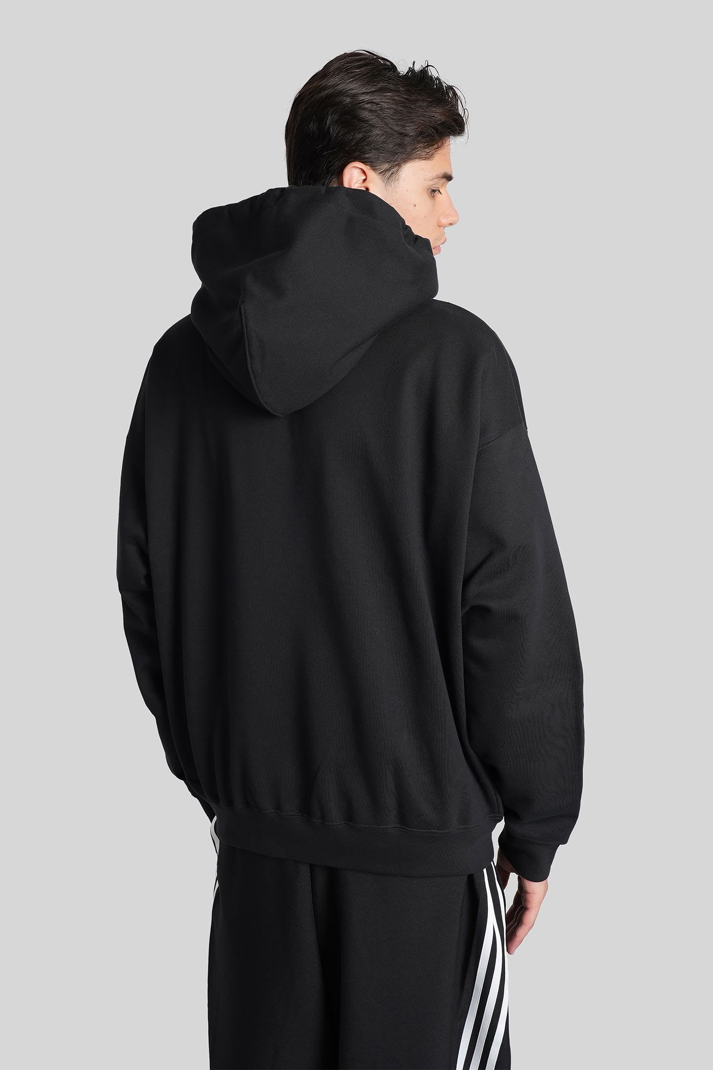 Y-3 Relaxed-fit Black Hoodie With Subtle Front Logo And Side Pockets In Black