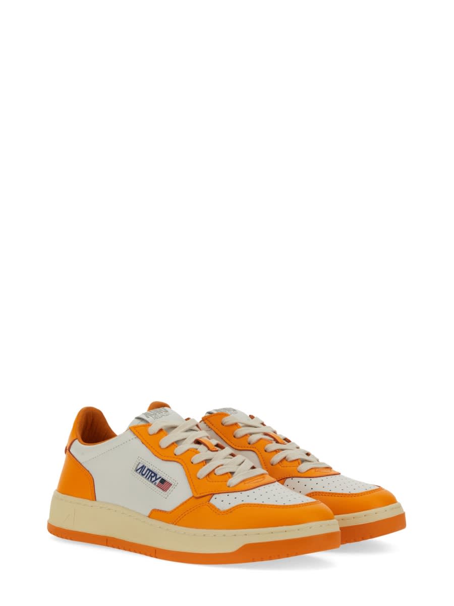 Shop Autry Medalist Low Sneaker In Orange