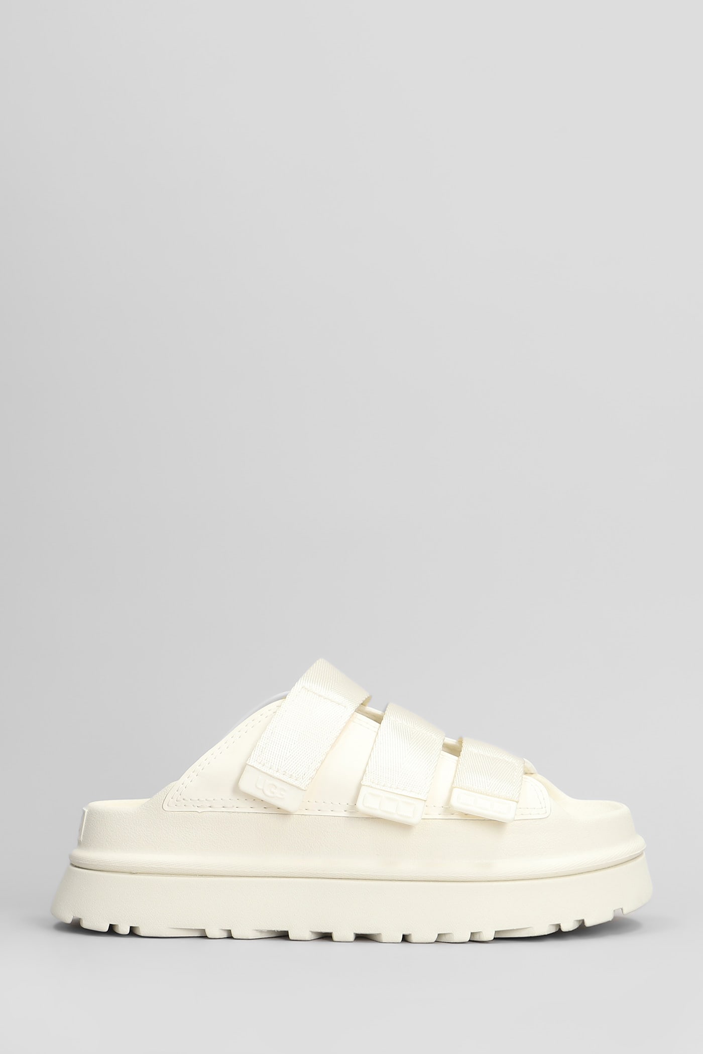 UGG GOLDENGLOW SLIDE SLIPPER-MULE IN BEIGE RUBBER/PLASIC