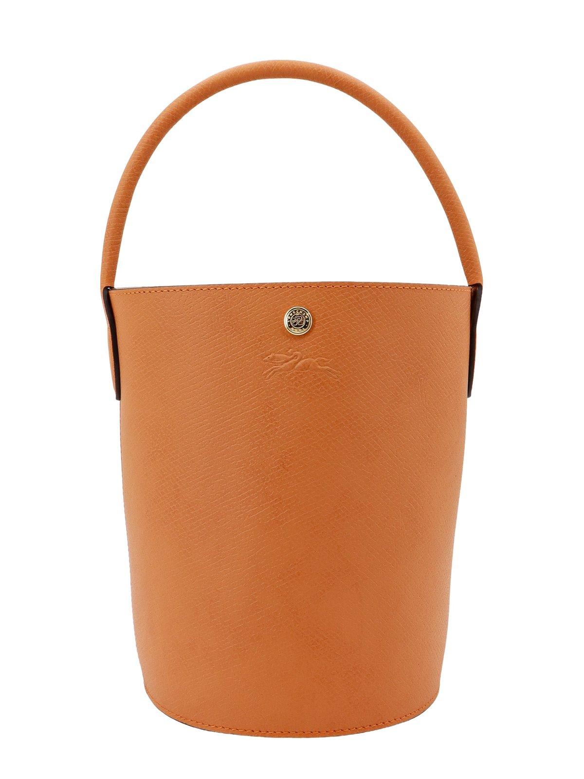 Shop Longchamp Re Logo Embossed Small Bucket Bag In Orange