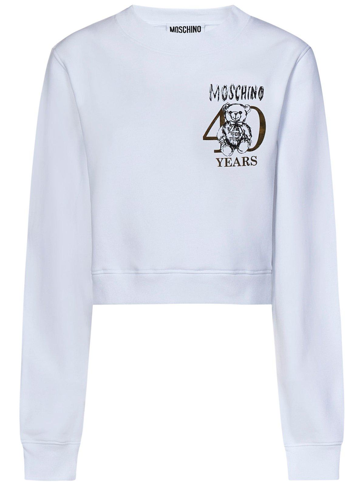 Shop Moschino Logo Printed Crewneck Cropped Sweatshirt
