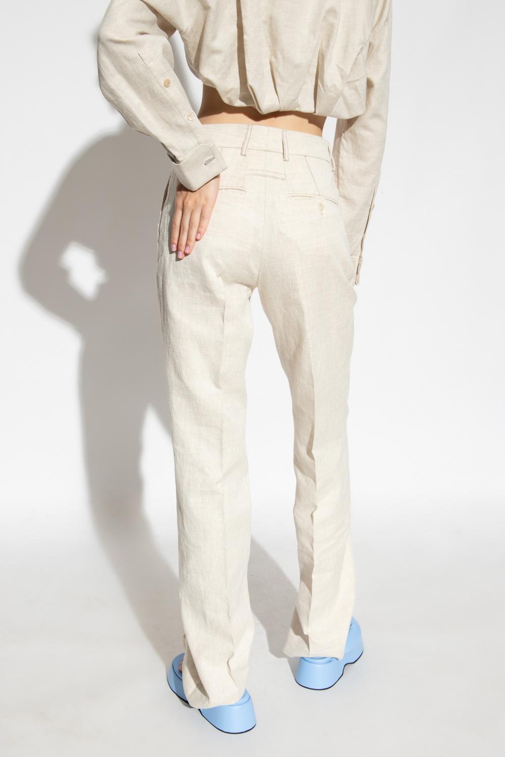 Shop Jacquemus Camargue Pleat-front Trousers In Beige