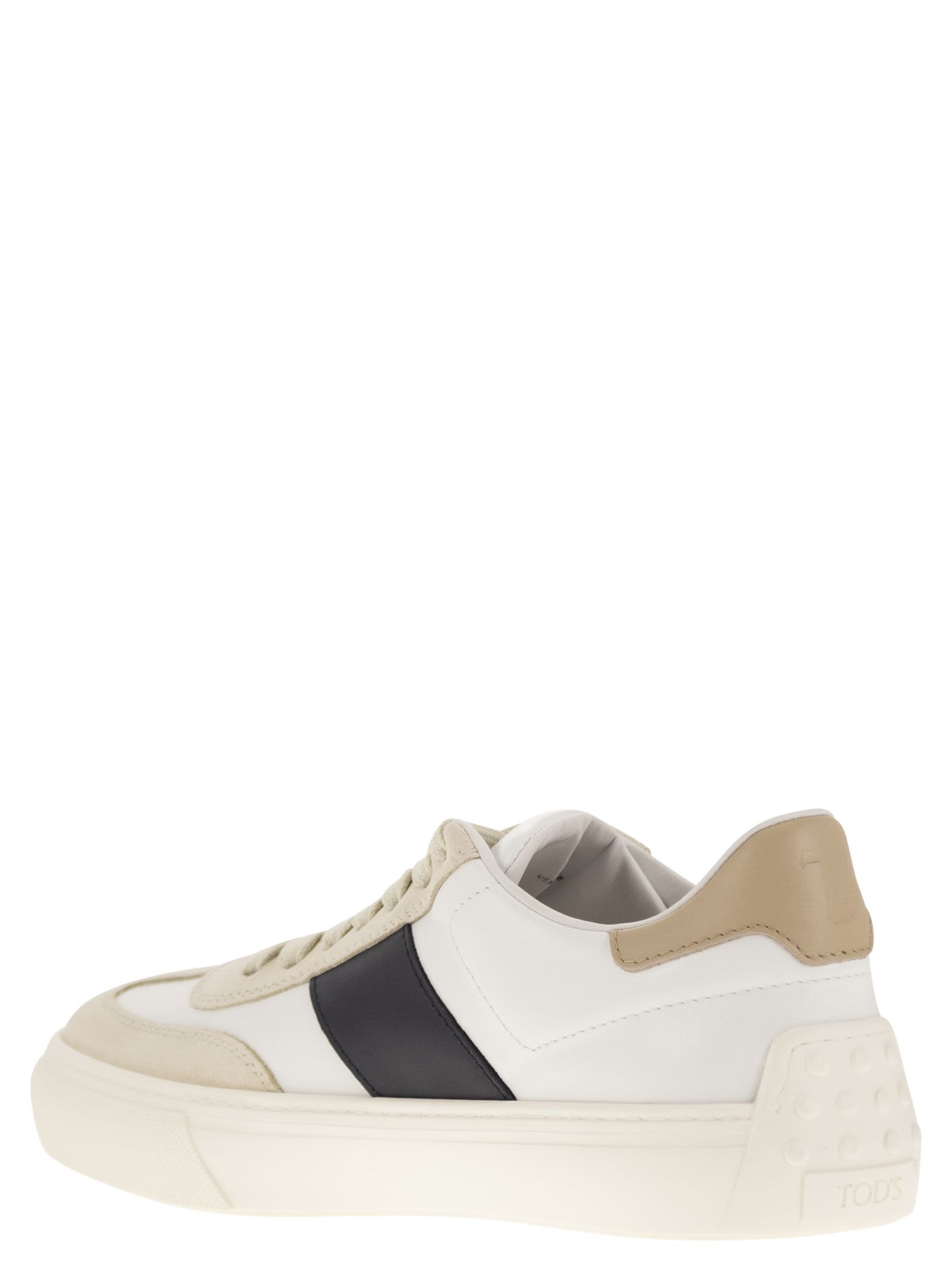 Shop Tod's Leather Sneakers In Milk