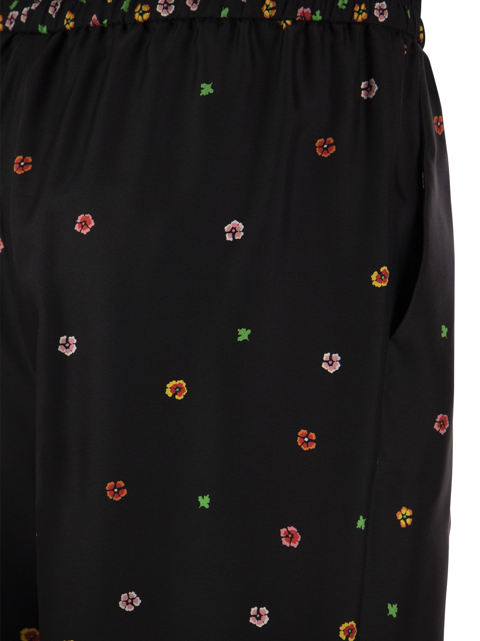 Shop Red Valentino Floral Print Silk Trousers  In Black