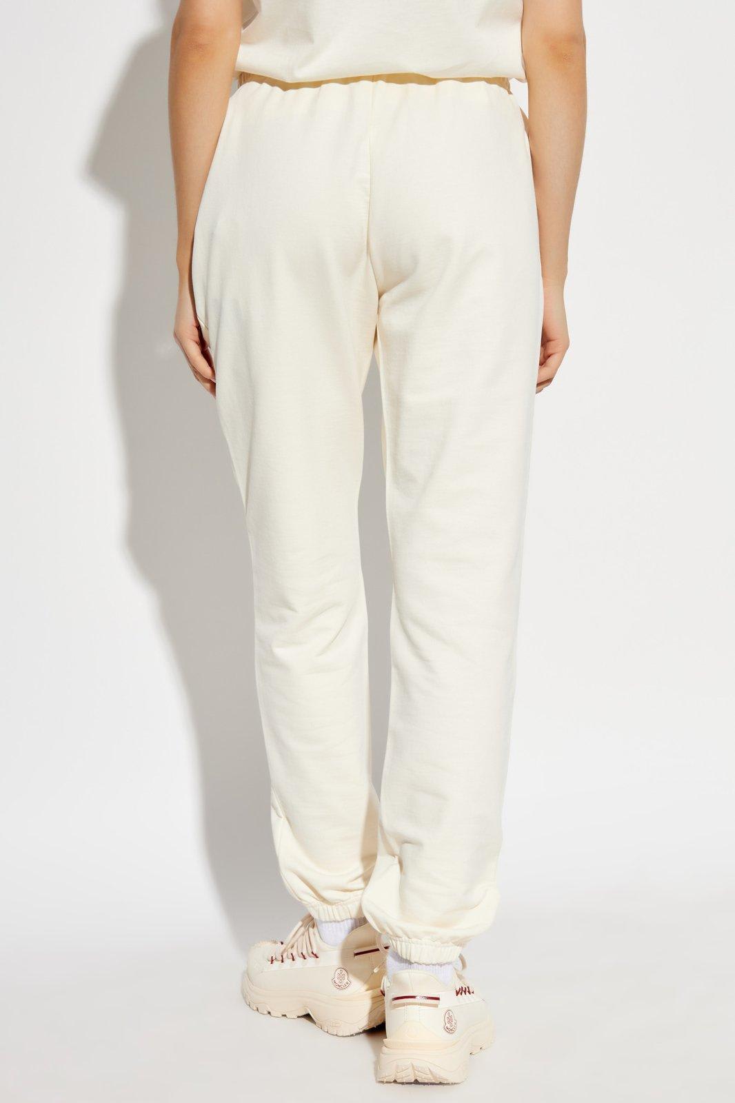 Shop Moncler Logo Patch Drawstring Sweatpants In 034