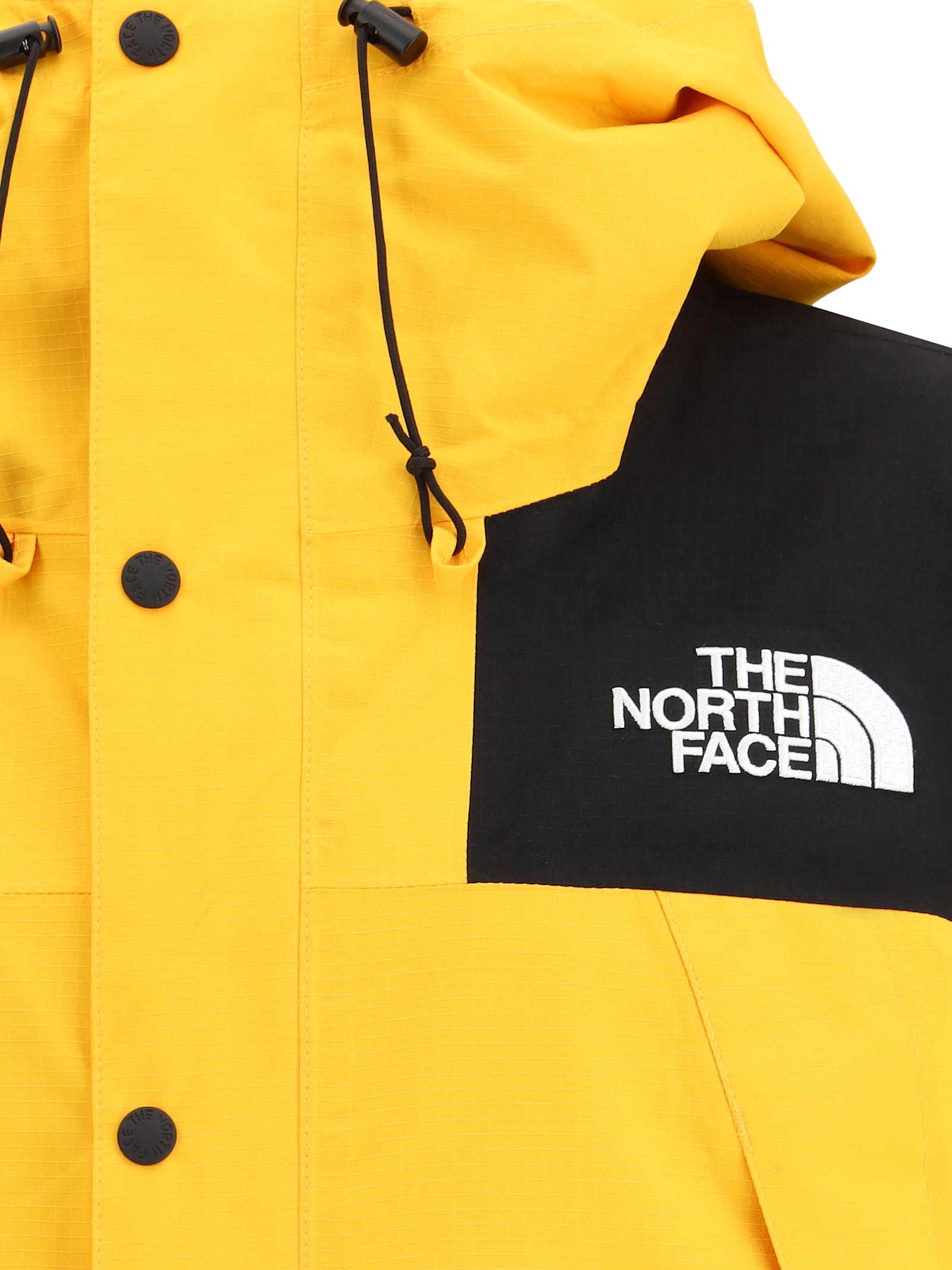 The North Face Windbreaker Jacket With Drawstring And Hood In Yellow