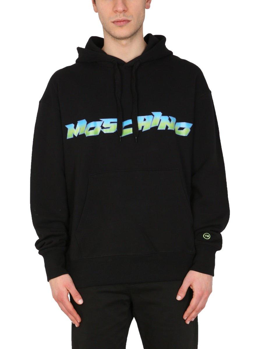 Shop Moschino Logo Printed Drawstring Hoodie In Black
