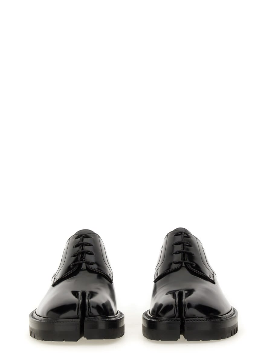 Shop Maison Margiela Tabi Lace-up. In Black