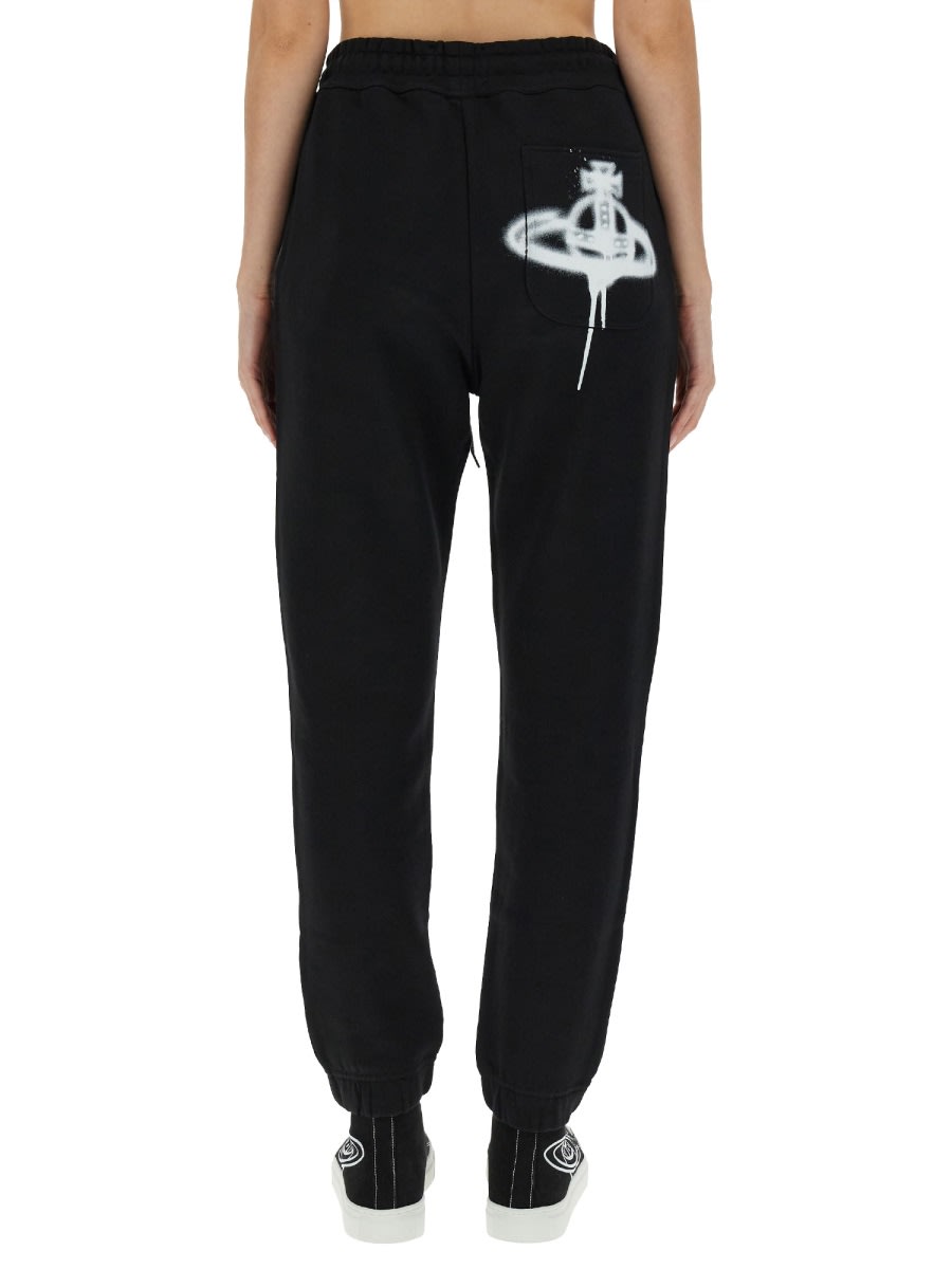 Shop Vivienne Westwood Jogging Pants With Spray Print Orb In Black