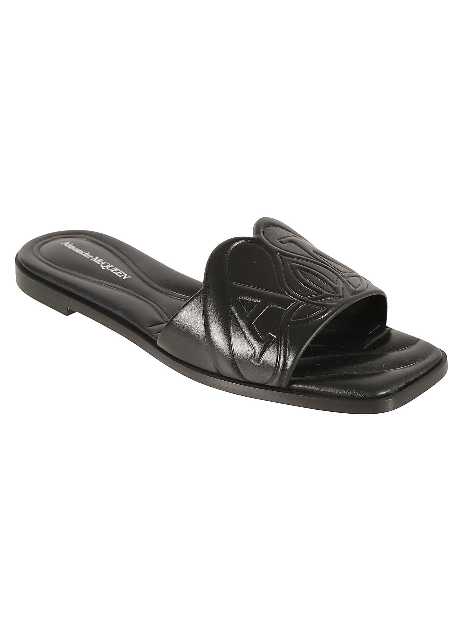 Shop Alexander Mcqueen New Gloss Logo Embossed Flat Sandals In Black