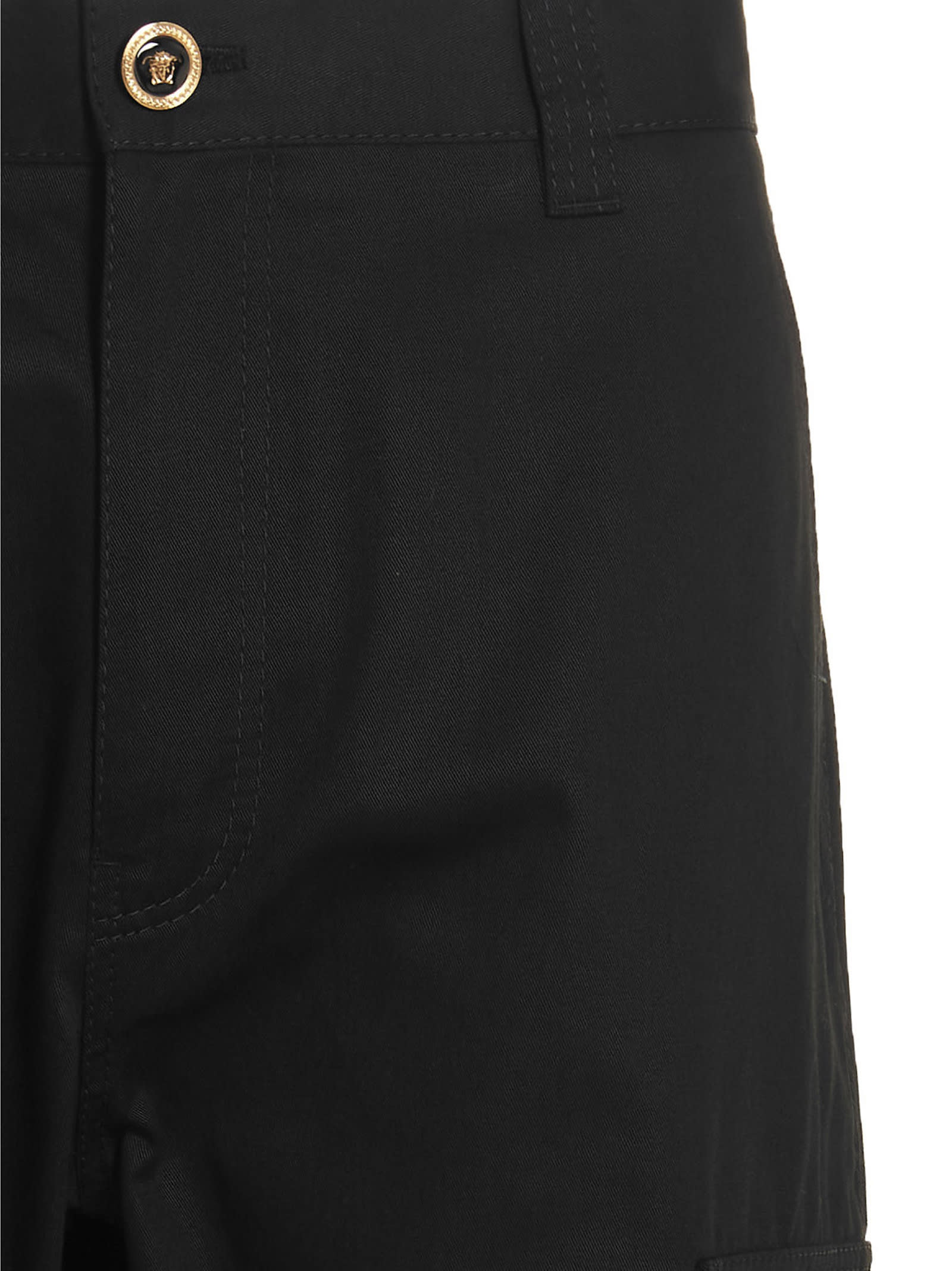 Shop Versace Logo Button Trousers In Black