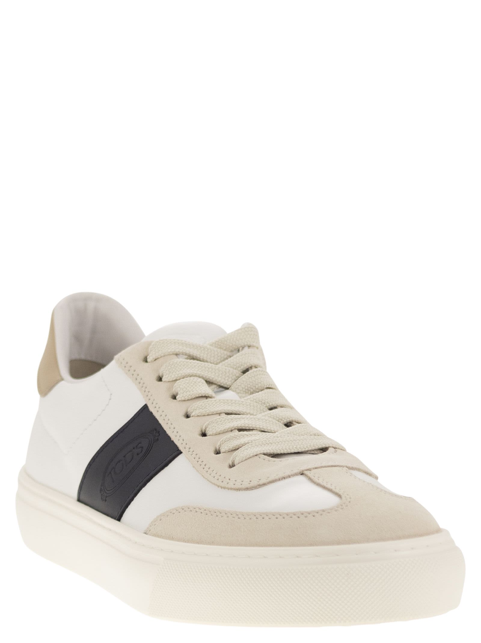 Shop Tod's Leather Sneakers In Milk