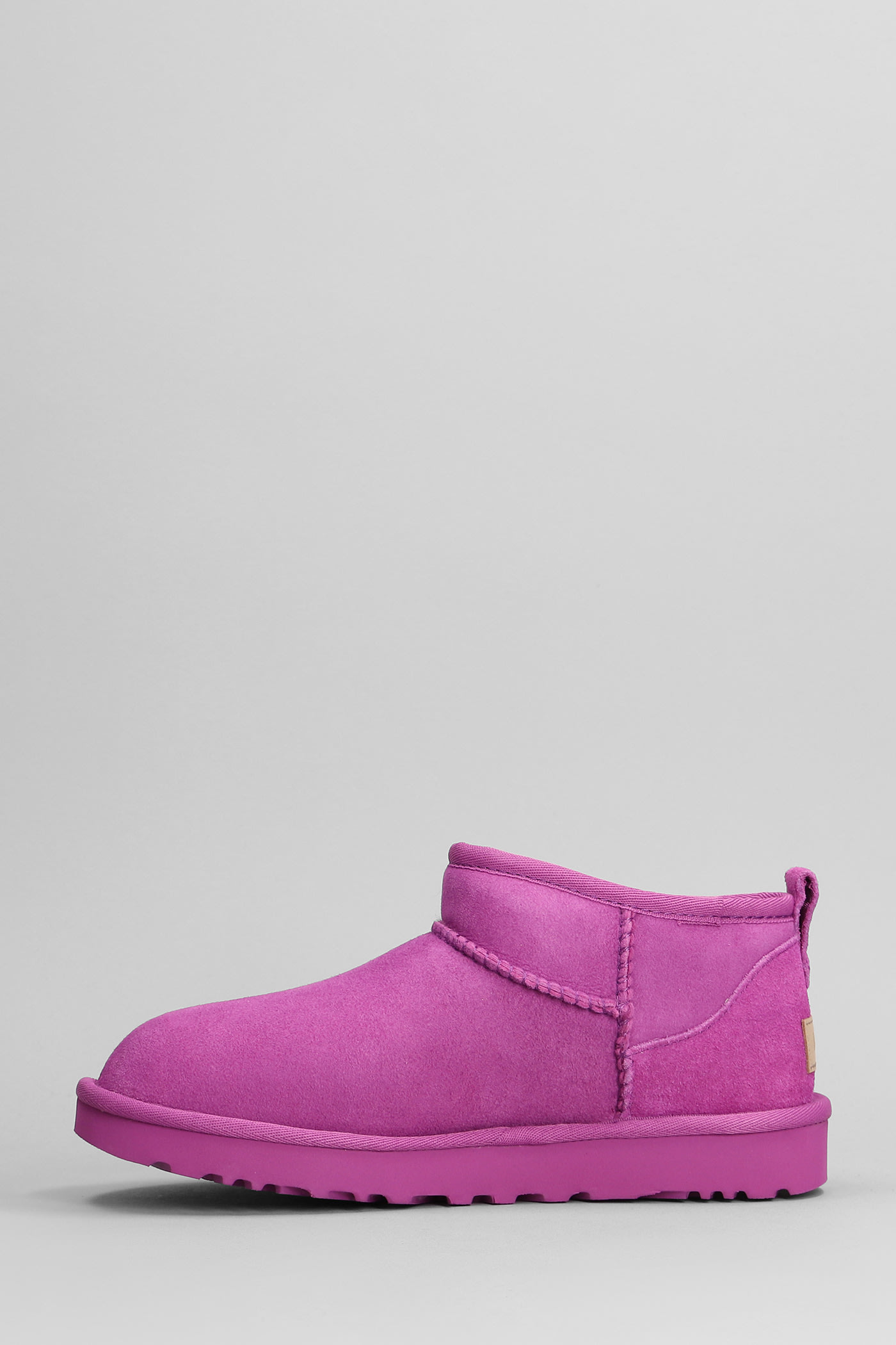 Shop Ugg Classic Ultra Mini Low Heels Ankle Boots In Fuxia Suede