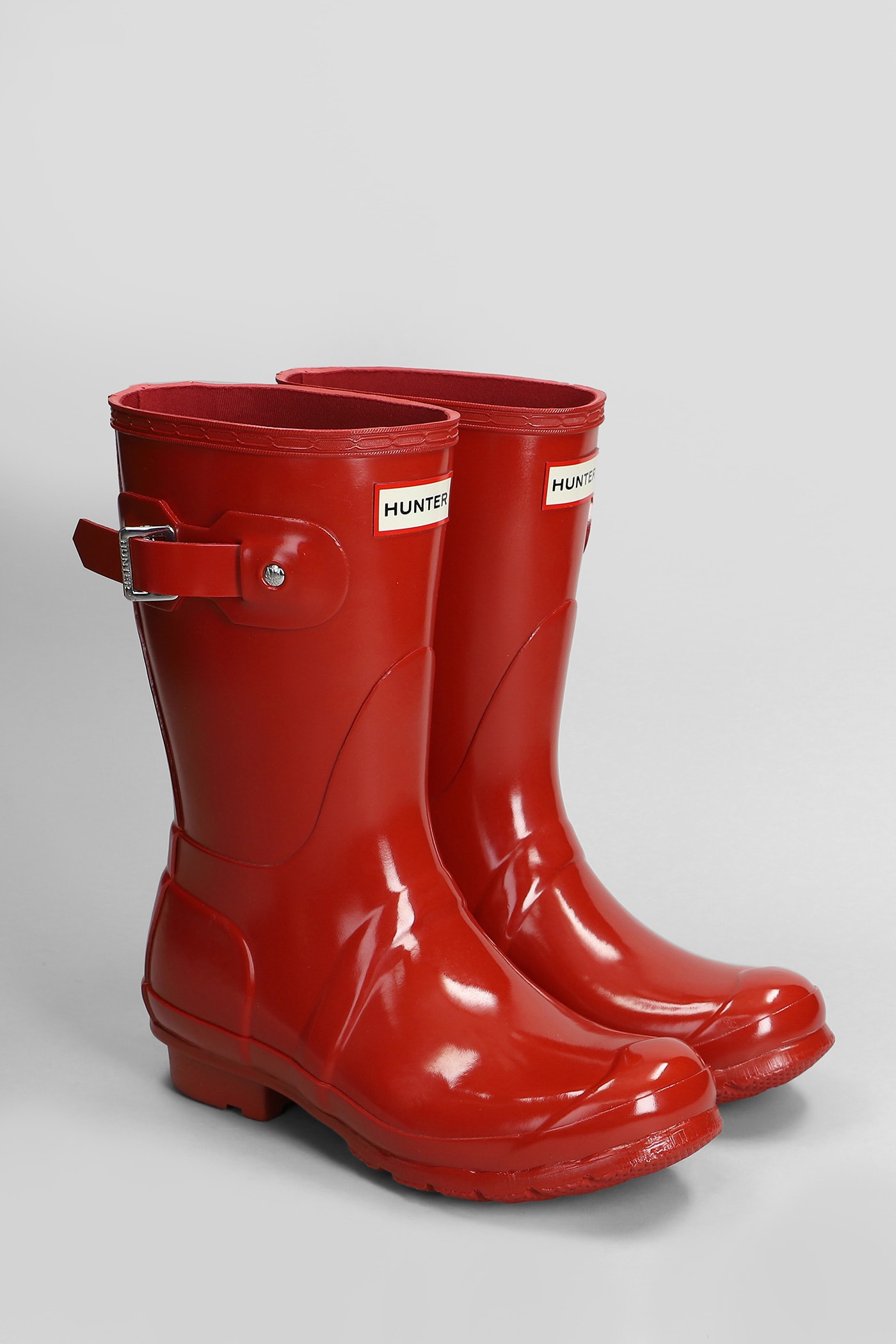 Shop Hunter Original Short Gloss Low Heels Boots In Red Rubber/plasic