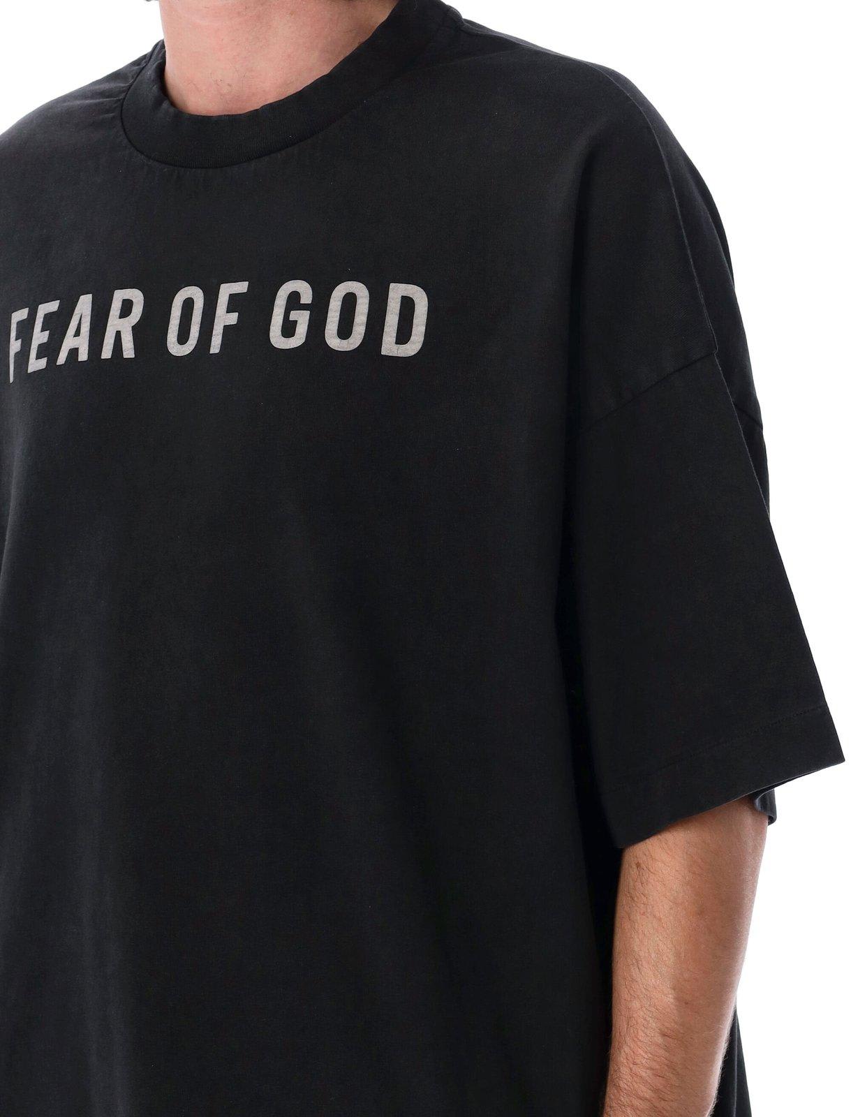 Shop Fear Of God Logo Printed Crewneck T-shirt In Black