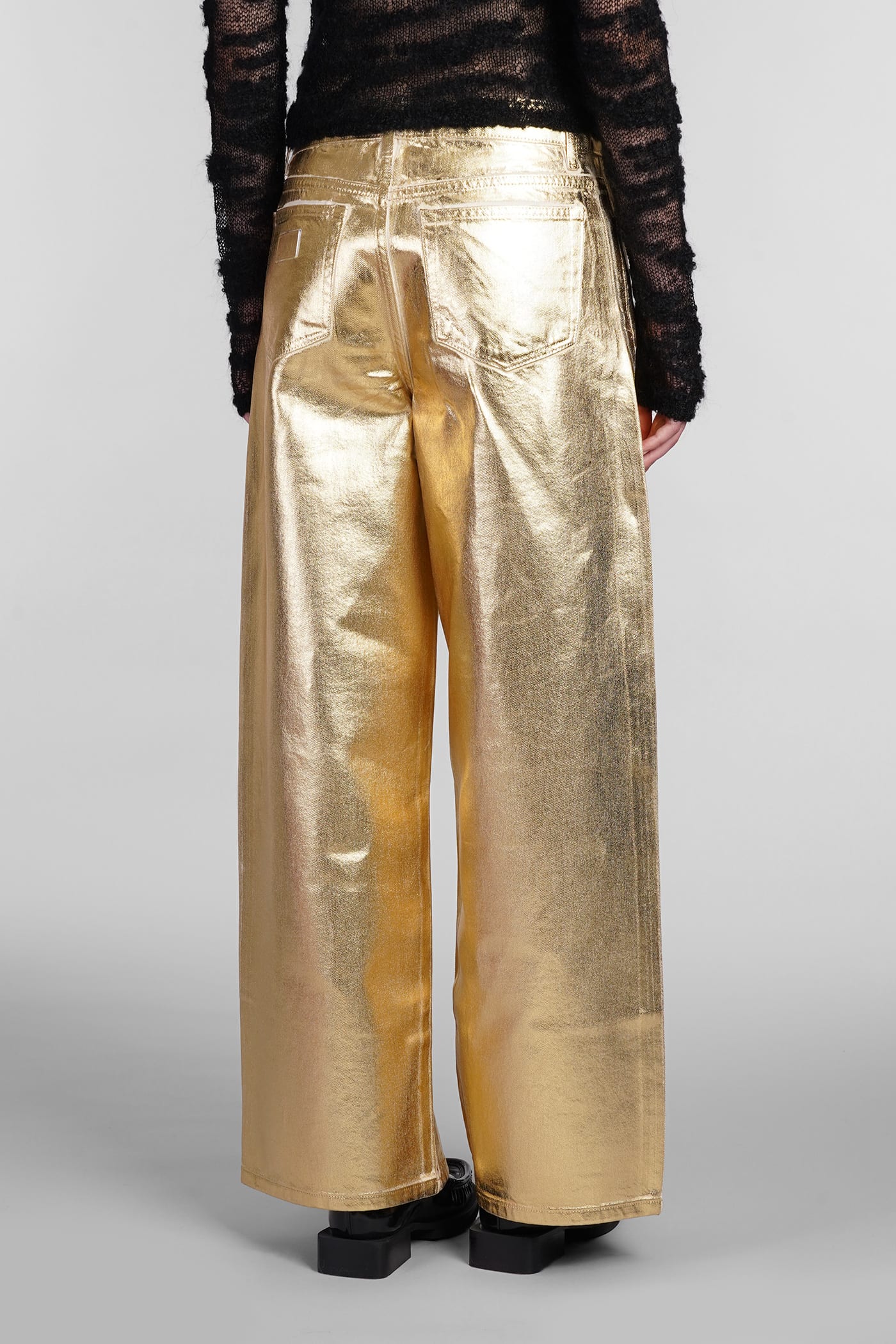 Shop Ganni Jeans In Gold Cotton