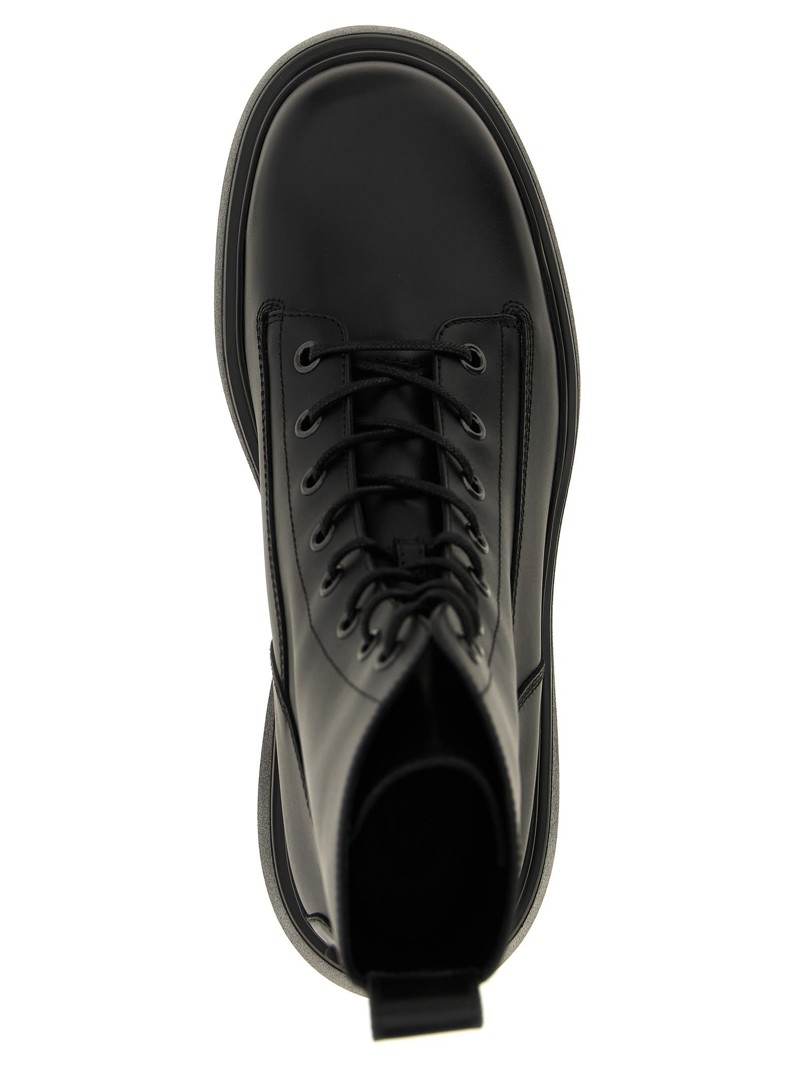 Tod's Chunky Sole Round Toe Ankle Boots With Pull Tab In Black