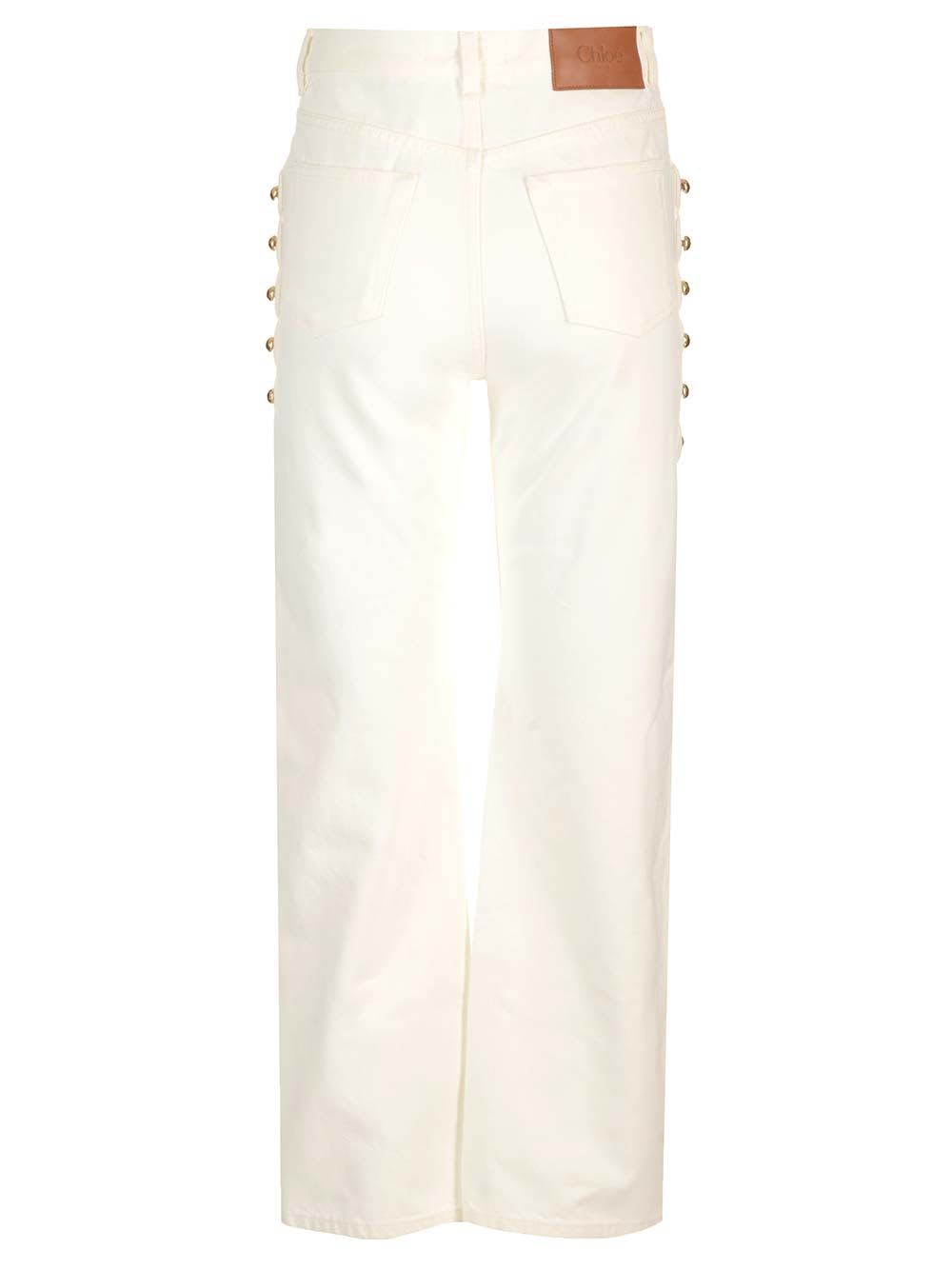 Shop Chloé Cropped Jeans With Embellished Profile In White