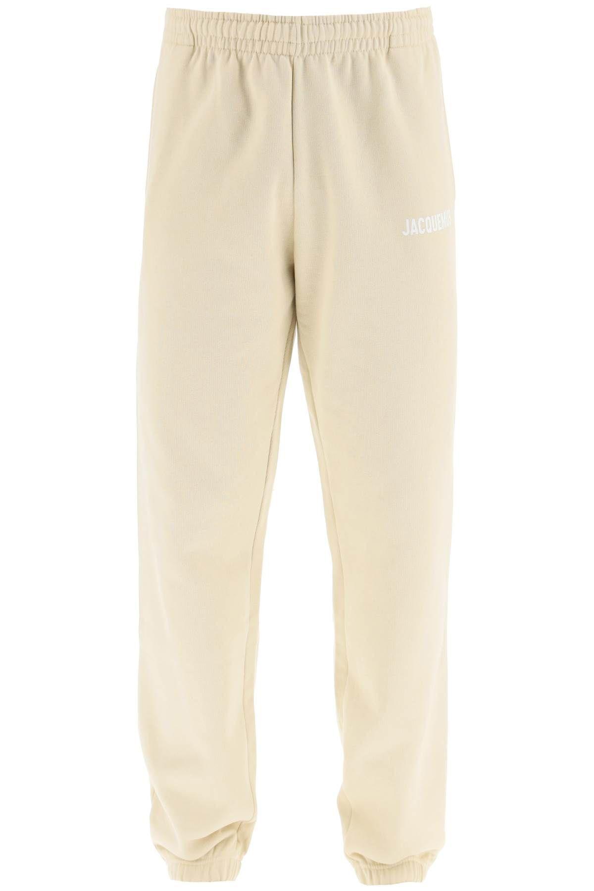 Shop Jacquemus Logo-print Organic Cotton Track Pants In Beige