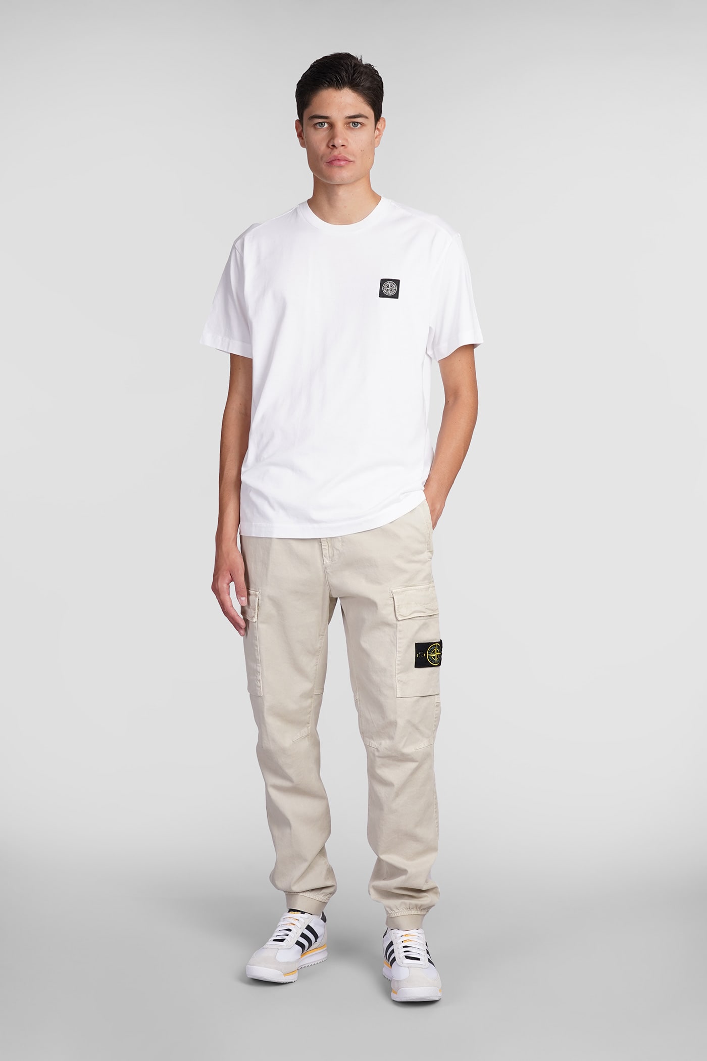 Shop Stone Island Pants In Beige Cotton