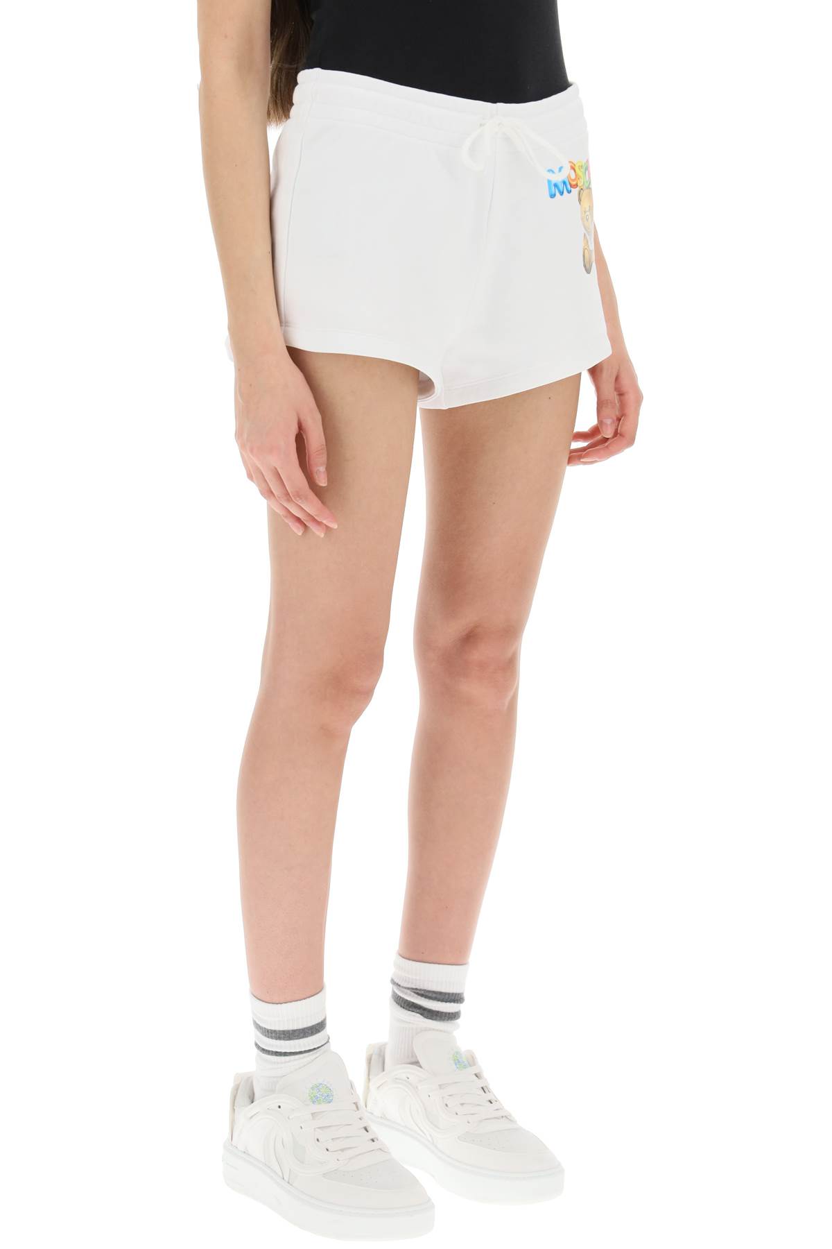 Shop Moschino Logo Printed Shorts In Fantasia Bianco (white)