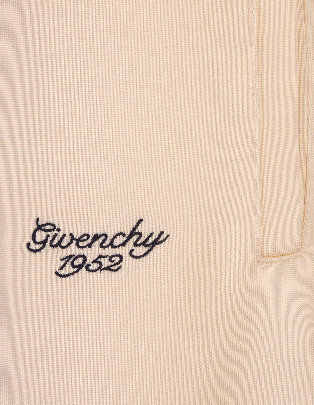 Shop Givenchy Ivory Jogging Trousers With Logo In White