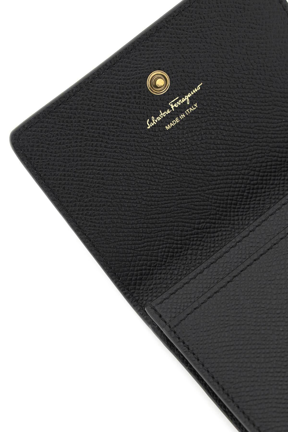 Shop Ferragamo Gancini Coin Purse In Black