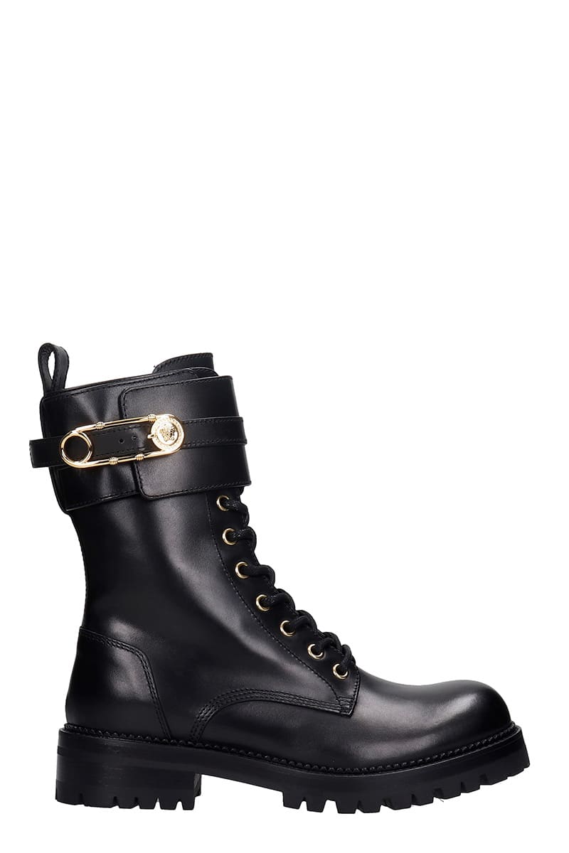 Buy Versace Combat Boots In Black Leather online, shop Versace shoes with free shipping