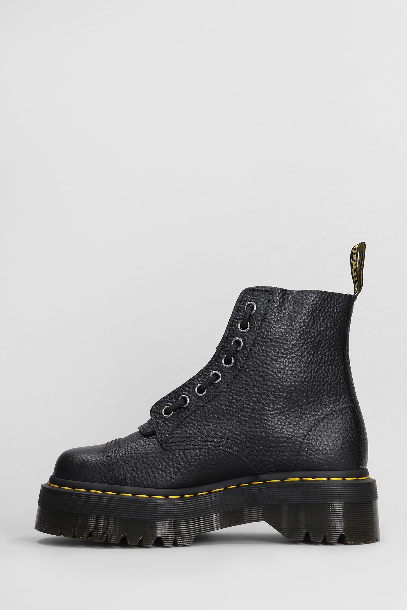 Dr. Martens Sinclair Combat Boot In Black Hammered Leather With A Large Treaded Sole In Animal Print