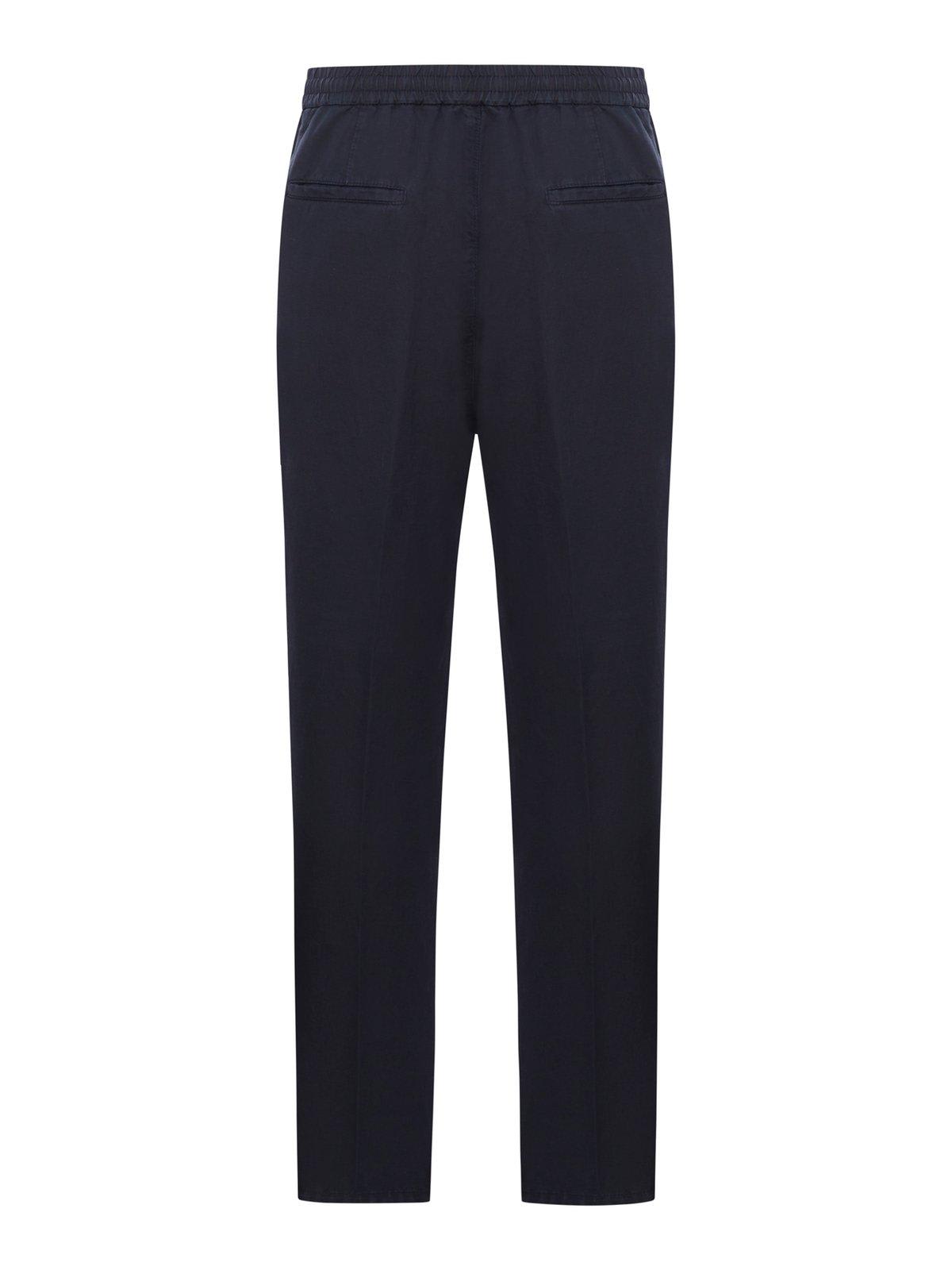 Shop Brunello Cucinelli Mid-rise Tapered-leg Trousers