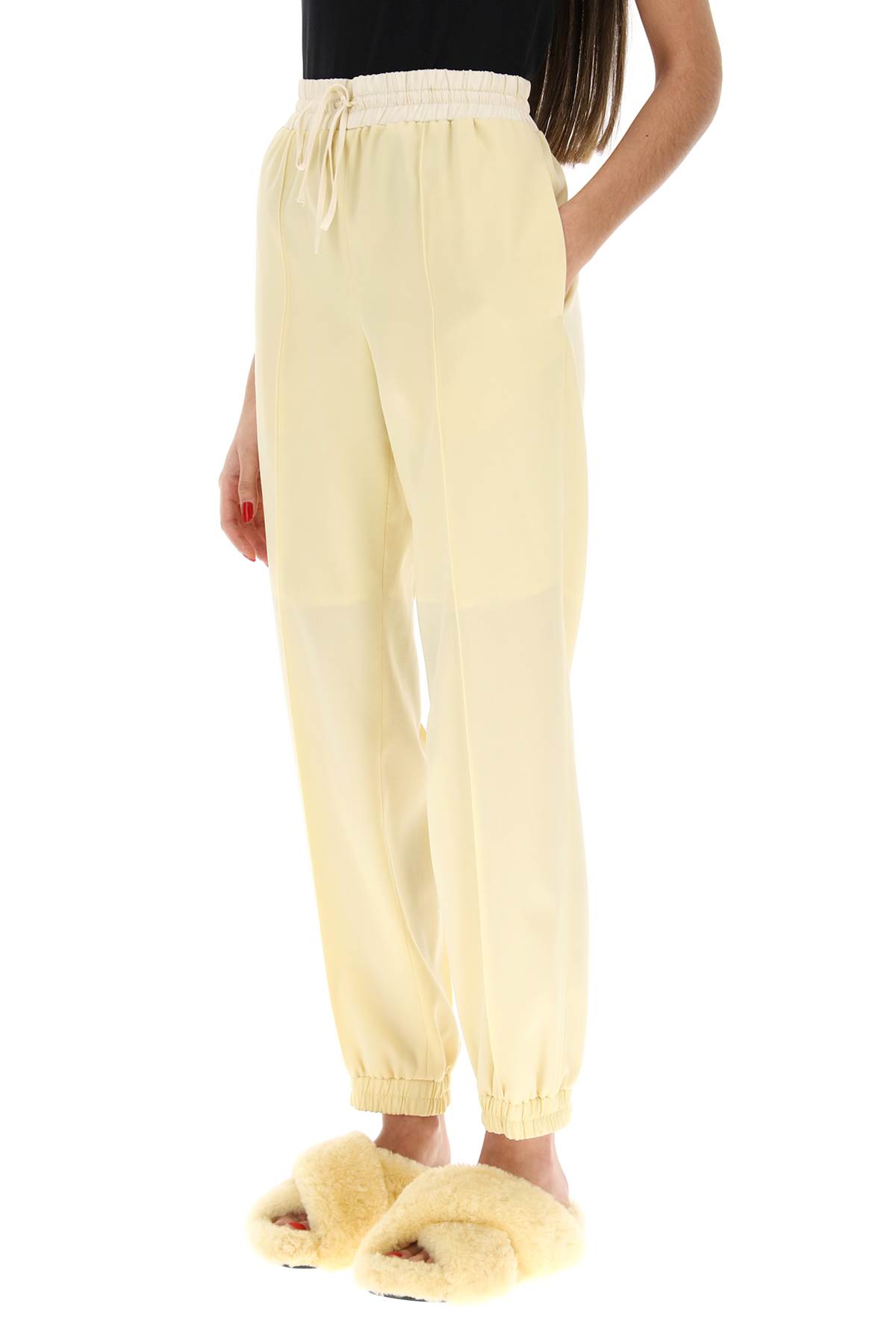 Shop Jil Sander Virgin Wool Jogger Pants In Butter (yellow)